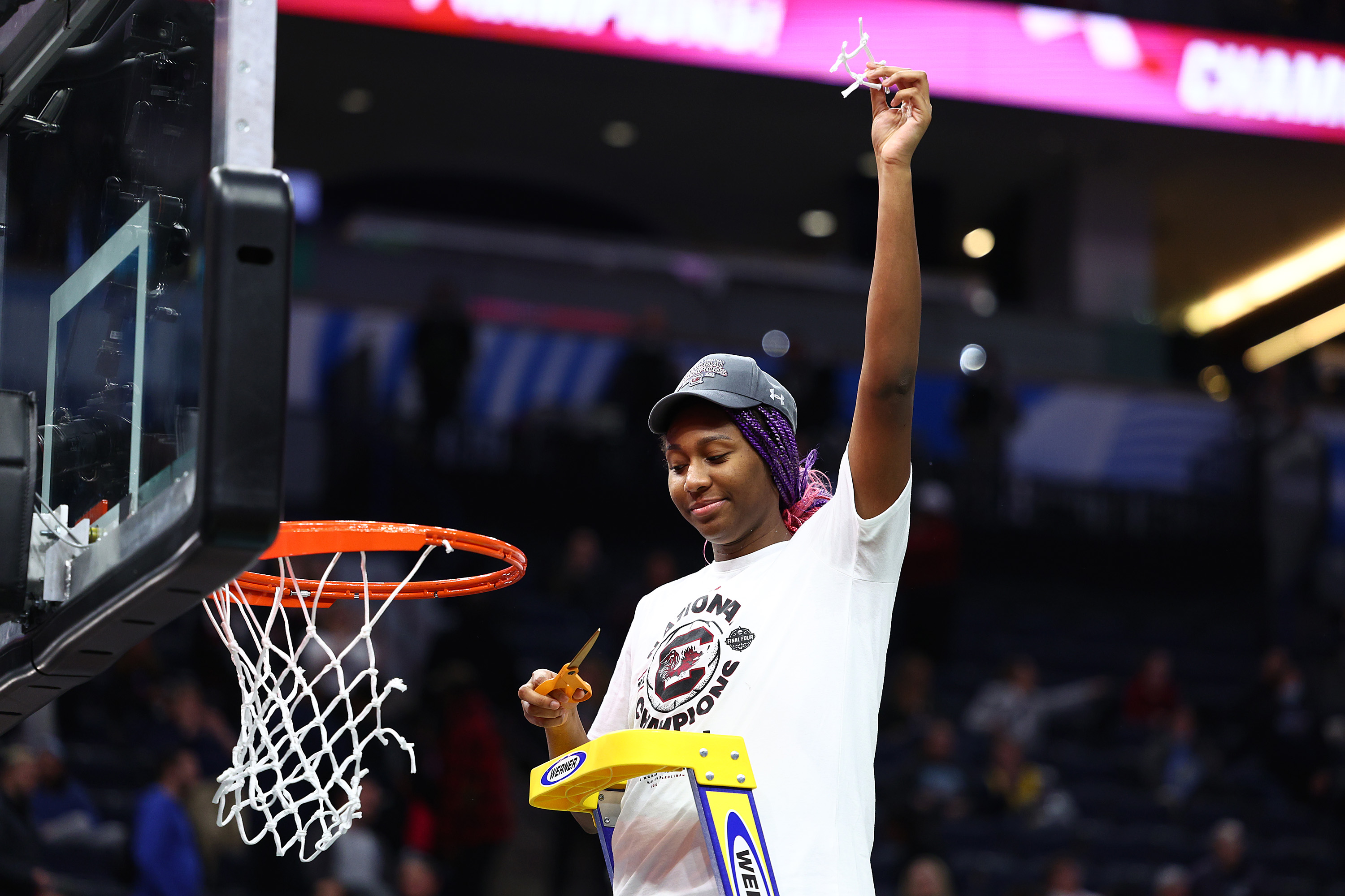 MINNEAPOLIS, MINNESOTA - APRIL 03: Aliyah Boston #4 of the South Carolina Gamecocks poses after cutting down a piece of the net after defeating the UConn Huskies 64-49 during the 2022 NCAA Women's Basketball Tournament National Championship game at Target Center on April 03, 2022 in Minneapolis, Minnesota. (Photo by Elsa/Getty Images)