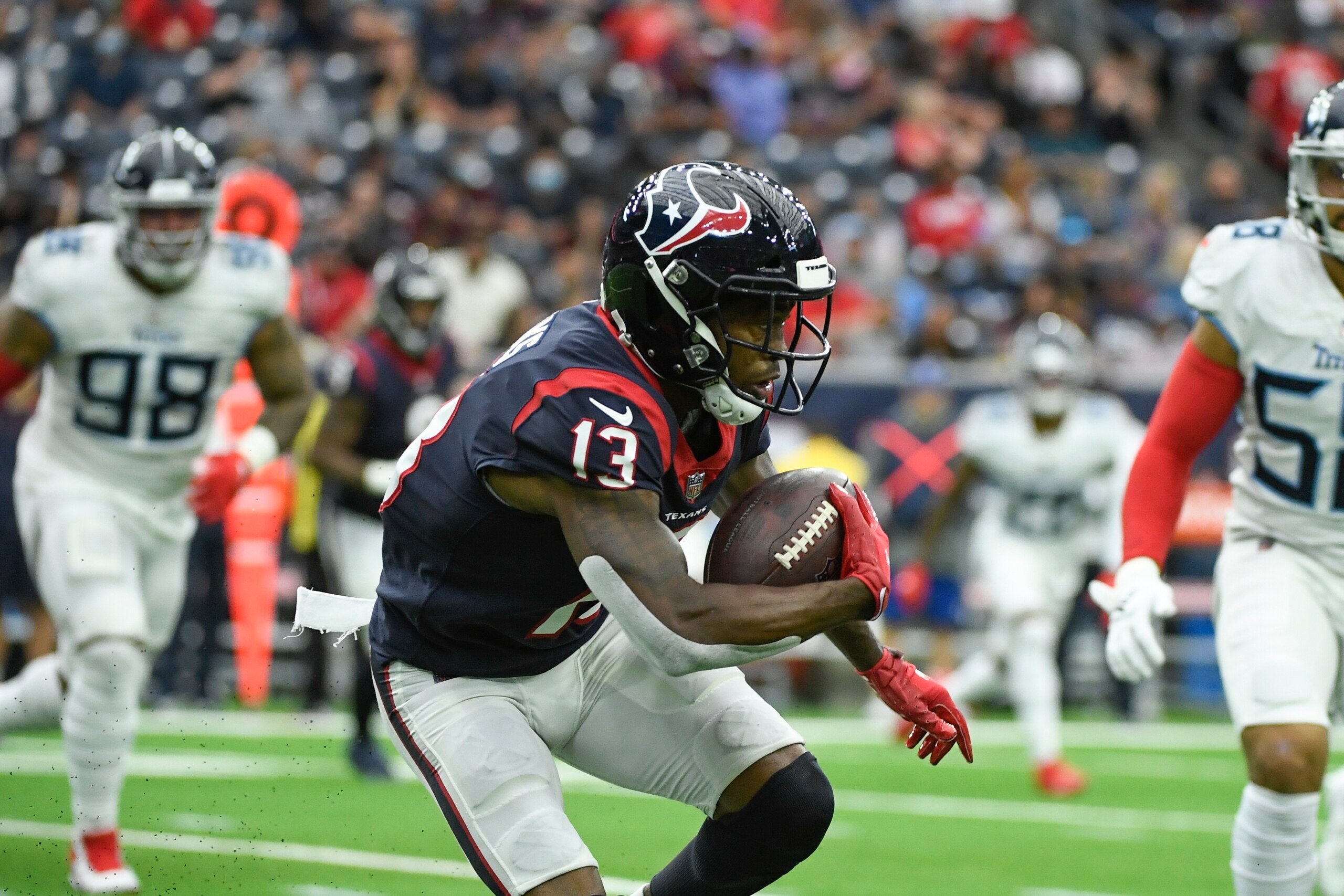 Houston Texans wide receiver Brandin Cooks (13) runs with the ball against the Tennessee Titans during the first half of an NFL football game Sunday, Jan. 9, 2022, in Houston. (AP Photo/Justin Rex)