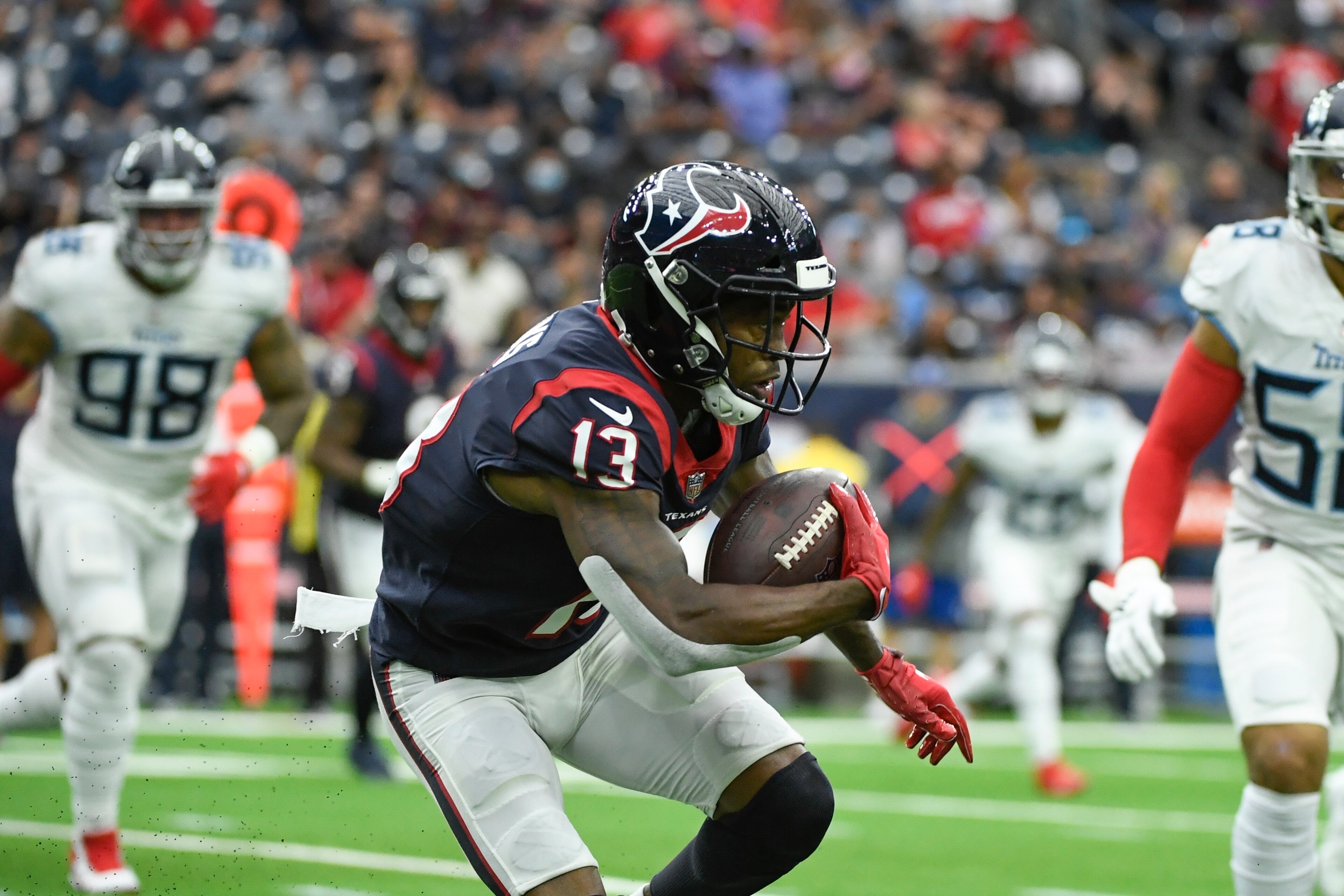 Houston Texans wide receiver Brandin Cooks (13) runs with the ball against the Tennessee Titans during the first half of an NFL football game Sunday, Jan. 9, 2022, in Houston. (AP Photo/Justin Rex)