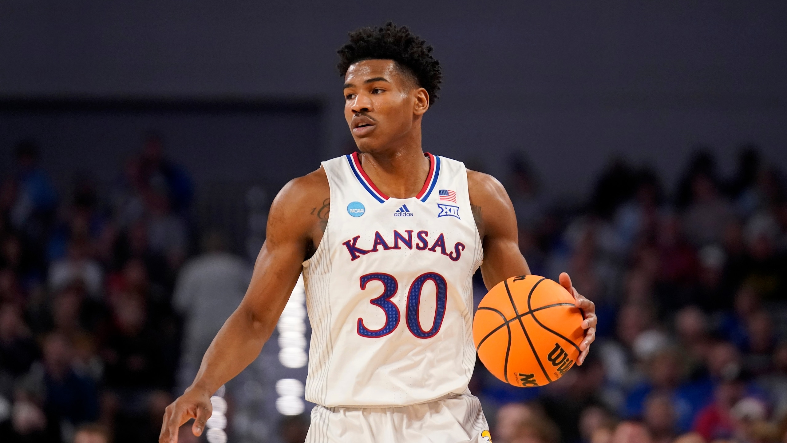 Kansas guard Ochai Agbaji handles the ball during a second-round game against Creighton in the NCAA college basketball tournament in Fort Worth, Texas, Saturday, March, 19, 2022. (AP Photo/Tony Gutierrez)
