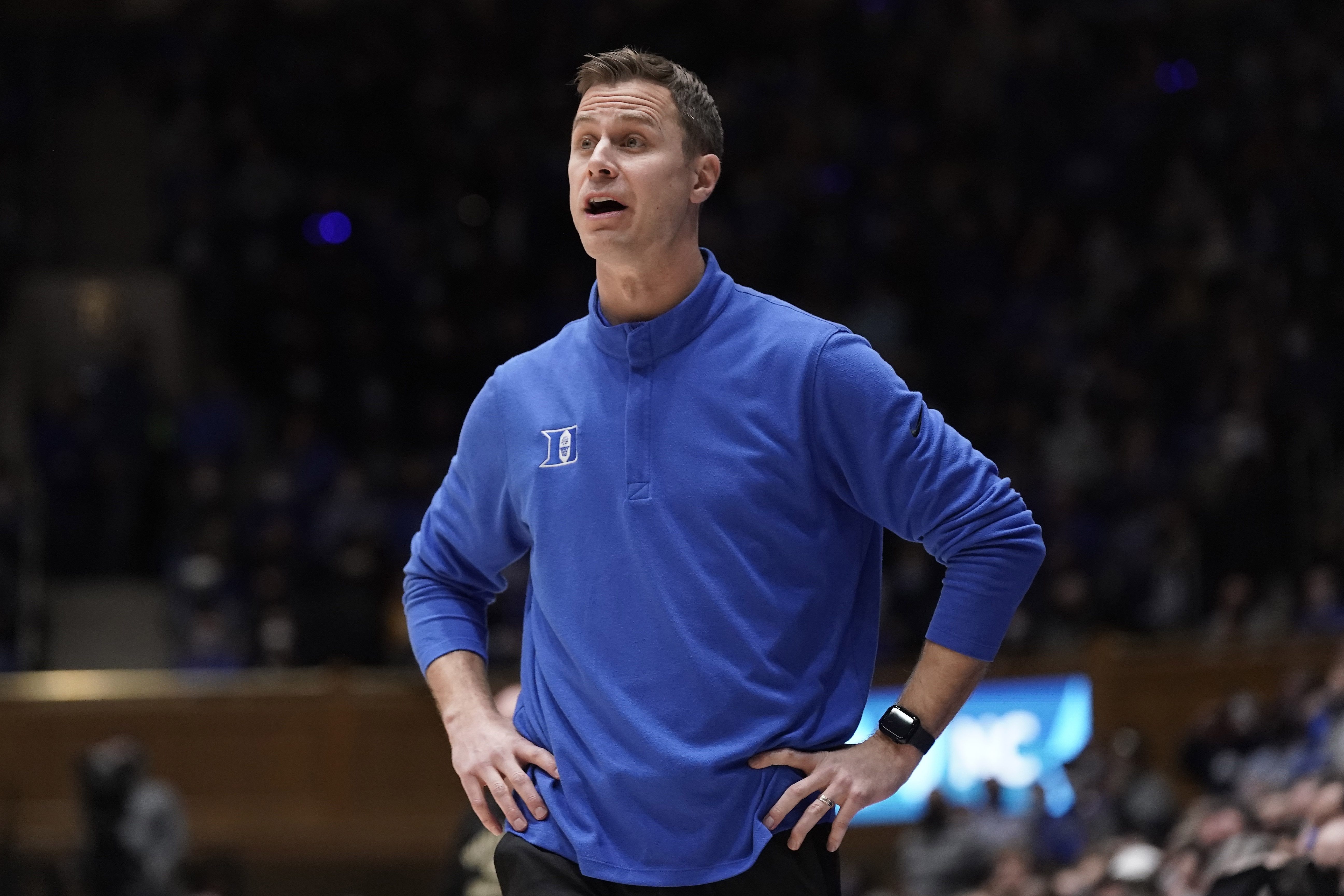 Duke associate head coach Jon Scheyer ditrects the team during the second half of an NCAA college basketball game against Wake Forest in Durham, N.C., Tuesday, Feb. 15, 2022. (AP Photo/Gerry Broome)