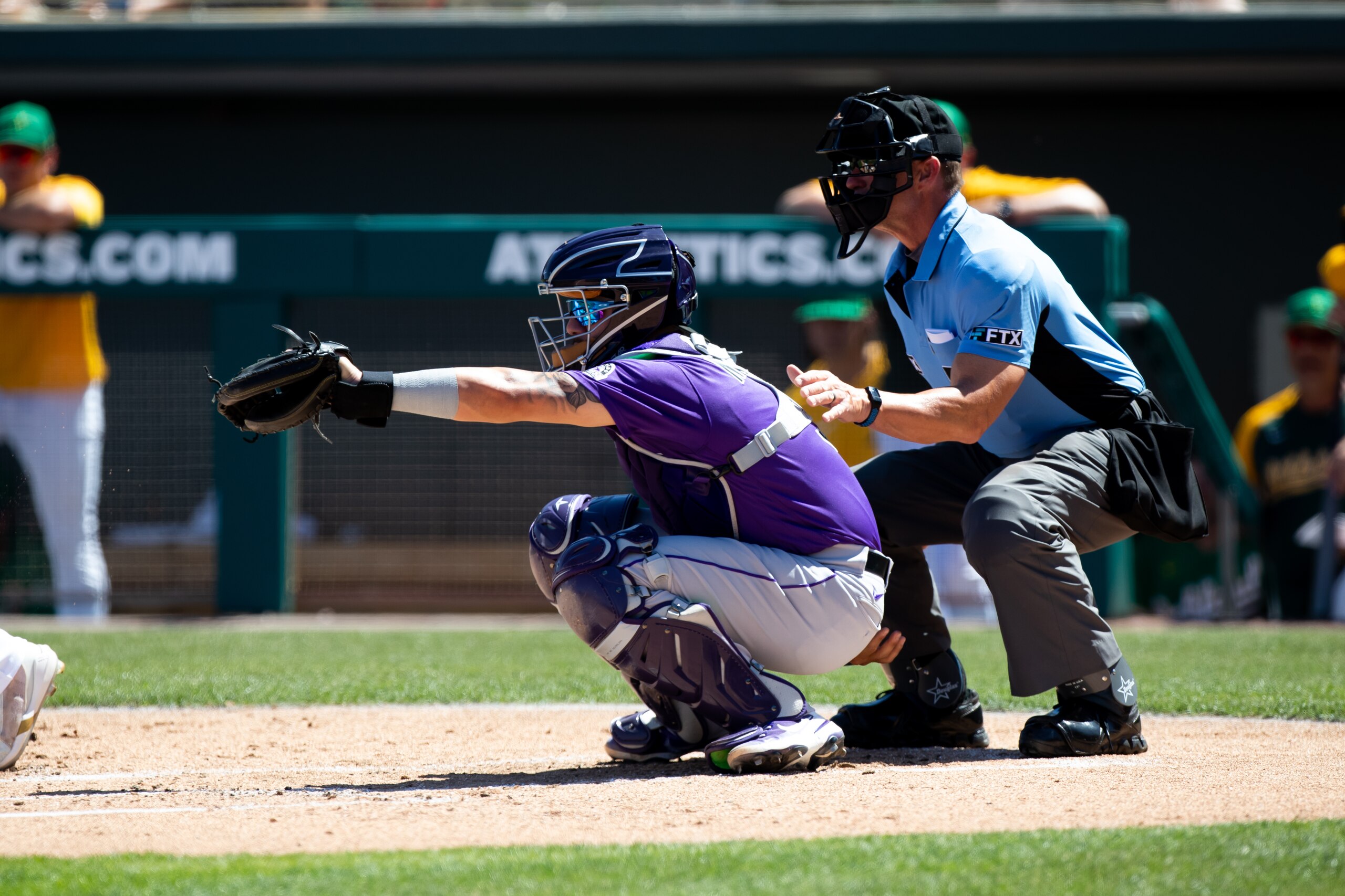 MESA, AZ - APRIL 2: Dom Nunez (3) of the Colorado Rockies makes a catch behind the plate during a Spring Training Baseball game between the Colorado Rockies and Oakland Athletics on April 2, 2022, at Hohokam Stadium in Mesa, AZ. (Photo by Zac BonDurant/Icon Sportswire via Getty Images)