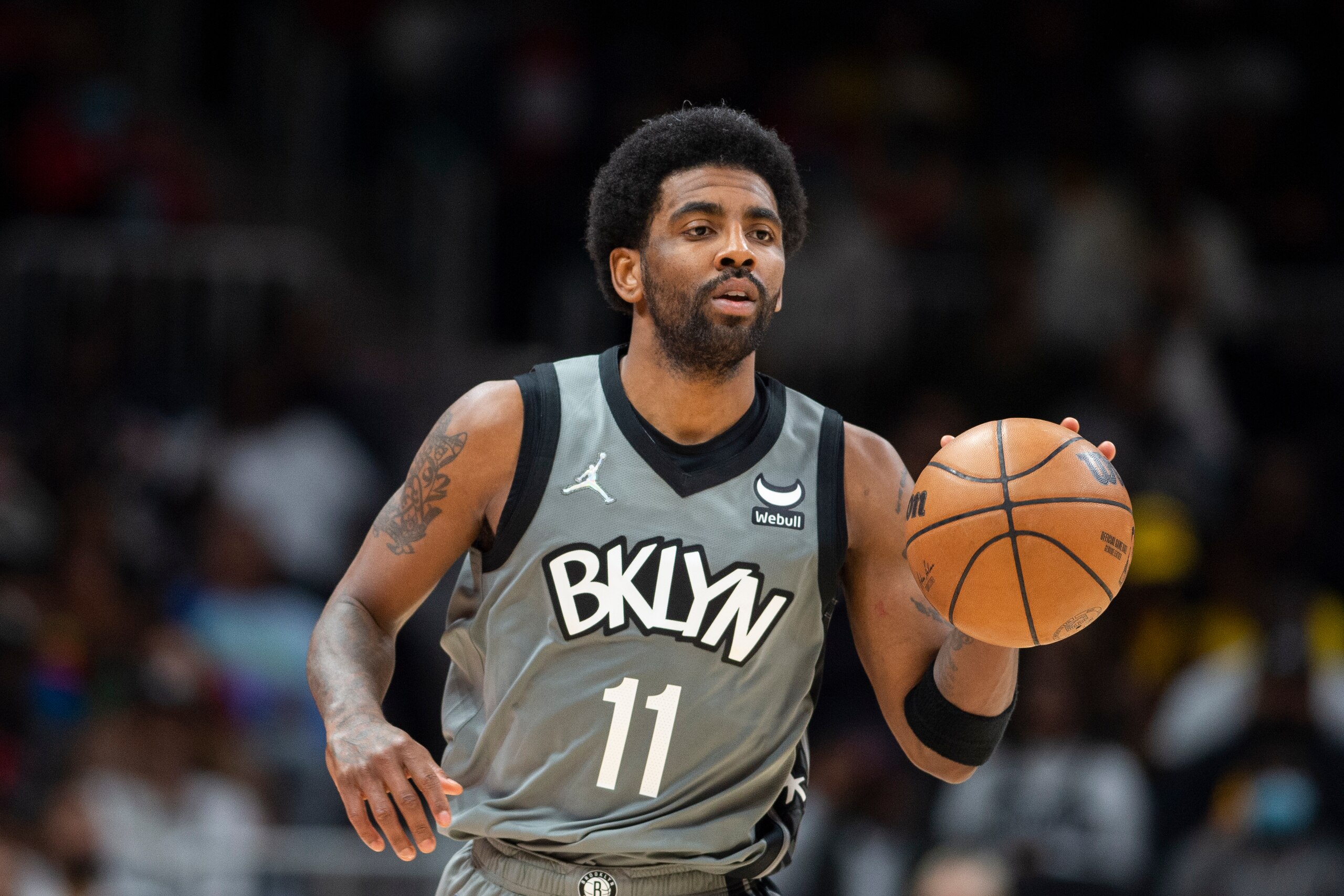 Brooklyn Nets guard Kyrie Irving (11) dribbles up court during the second half of an NBA basketball game against the Atlanta Hawks Saturday, April 2, 2022, in Atlanta. (AP Photo/Hakim Wright Sr.) Brooklyn Nets guard Kyrie Irving (11) dribbles up court during the second half of an NBA basketball game against the Atlanta Hawks Saturday, April 2, 2022, in Atlanta. (AP Photo/Hakim Wright Sr.)