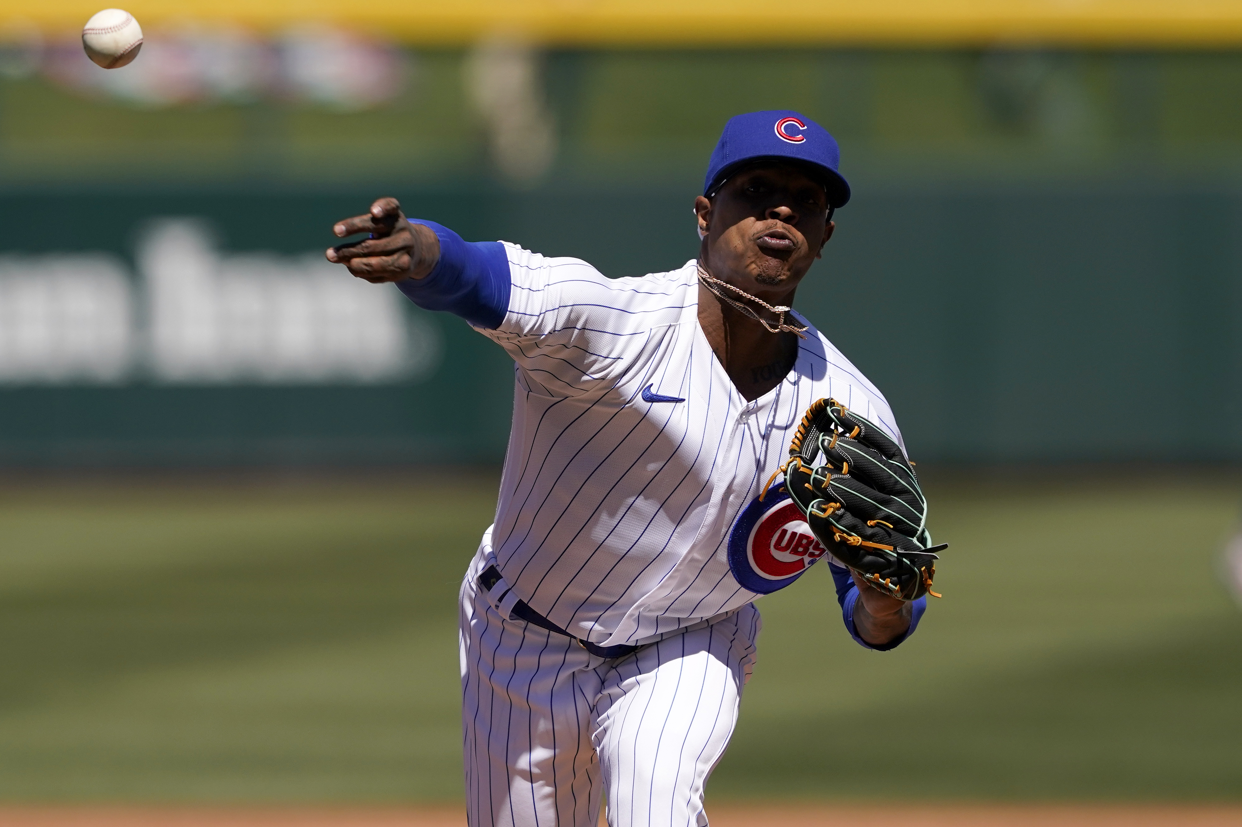 Chicago Cubs starting pitcher Marcus Stroman warms up during the first inning of a spring training baseball game against the Oakland Athletics, Wednesday, March 23, 2022, in Mesa, Ariz. (AP Photo/Matt York)