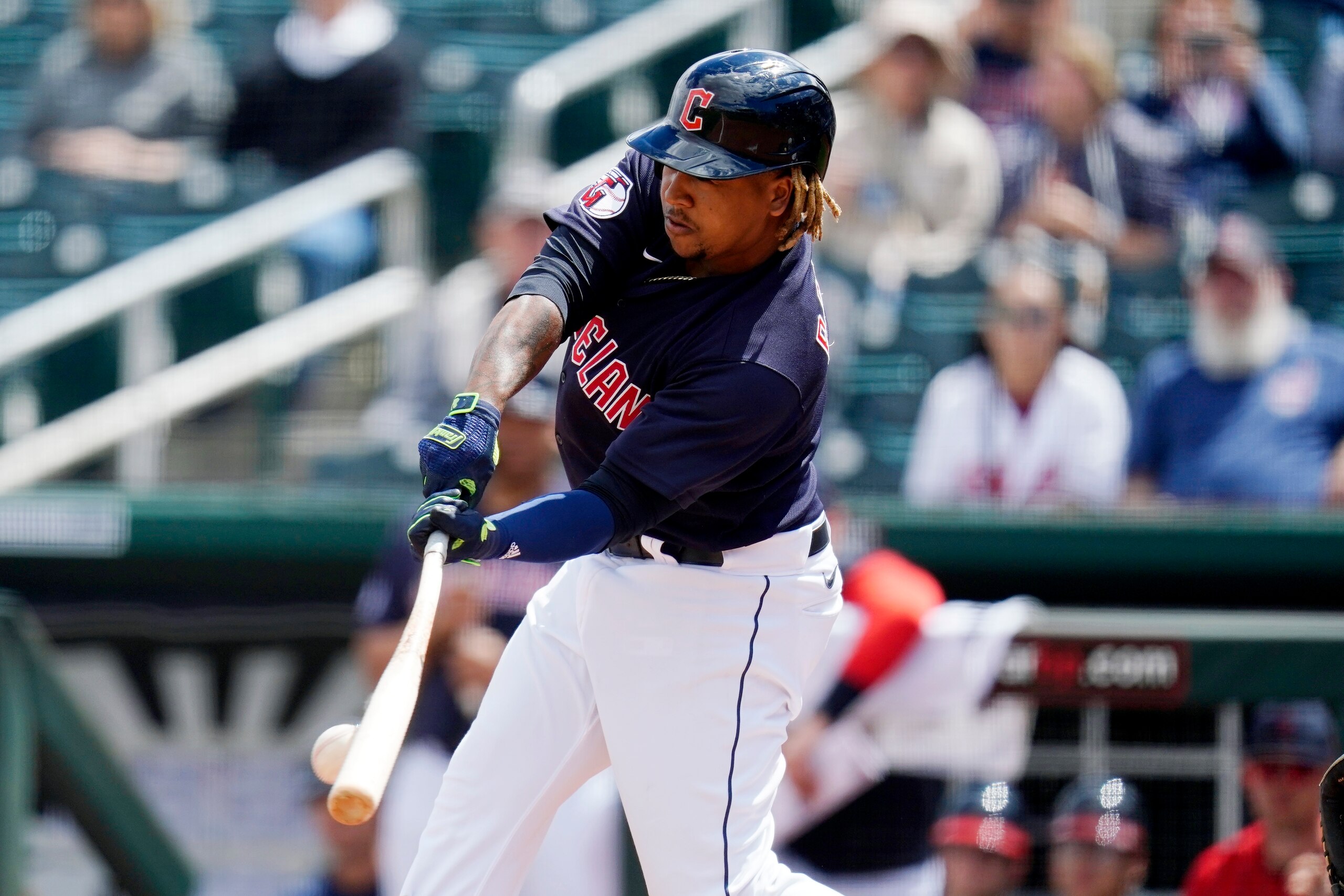 Cleveland Guardians' Jose Ramirez connects with the ball during the first inning of a spring training baseball game against the Milwaukee Brewers Tuesday, March 29, 2022, in Goodyear, Ariz. (AP Photo/Ross D. Franklin)
