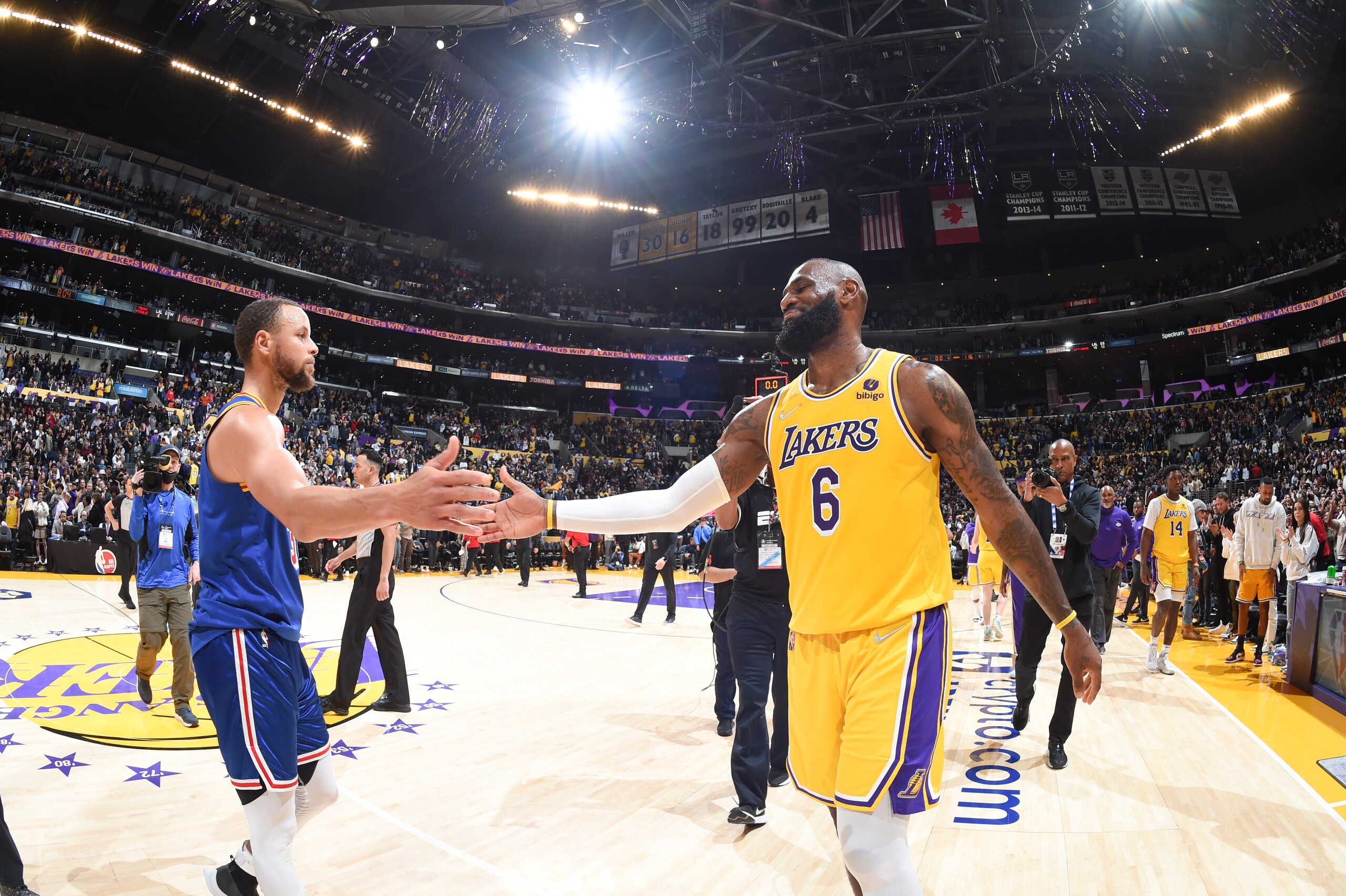 LOS ANGELES, CA - MARCH 5: LeBron James #6 of the Los Angeles Lakers high fives Stephen Curry #30 of the Golden State Warriors after the game on March 5, 2022 at Crypto.Com Arena in Los Angeles, California. NOTE TO USER: User expressly acknowledges and agrees that, by downloading and/or using this Photograph, user is consenting to the terms and conditions of the Getty Images License Agreement. Mandatory Copyright Notice: Copyright 2022 NBAE (Photo by Andrew D. Bernstein/NBAE via Getty Images)