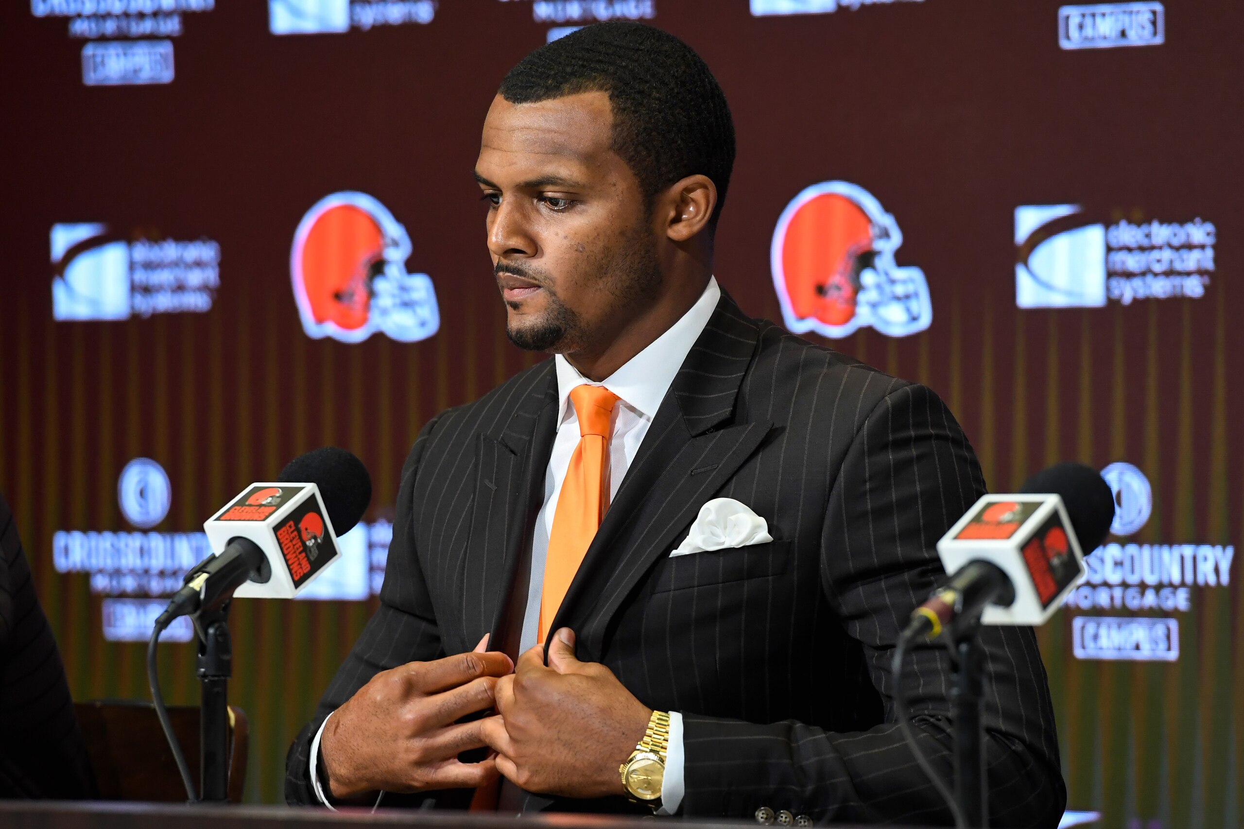 BEREA, OHIO - MARCH 25: Quarterback Deshaun Watson of the Cleveland Browns  adjusts his jacket during a press conference at CrossCountry Mortgage Campus on March 25, 2022 in Berea, Ohio. (Photo by Nick Cammett/Getty Images)