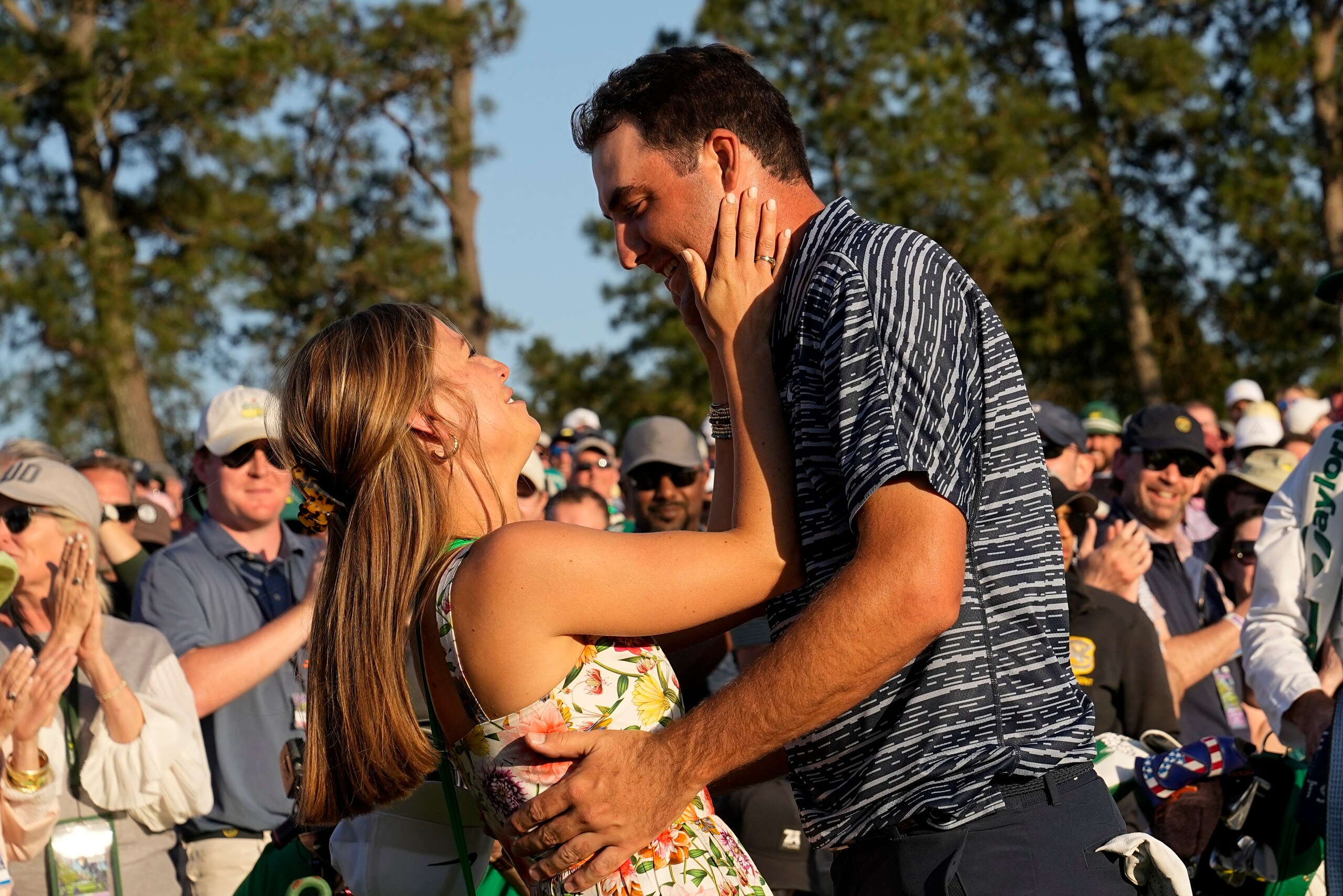 Scottie Scheffler hugs his wife Meredith Scudder after winning the 86th Masters golf tournament on Sunday, April 10, 2022, in Augusta, Ga. (AP Photo/David J. Phillip)