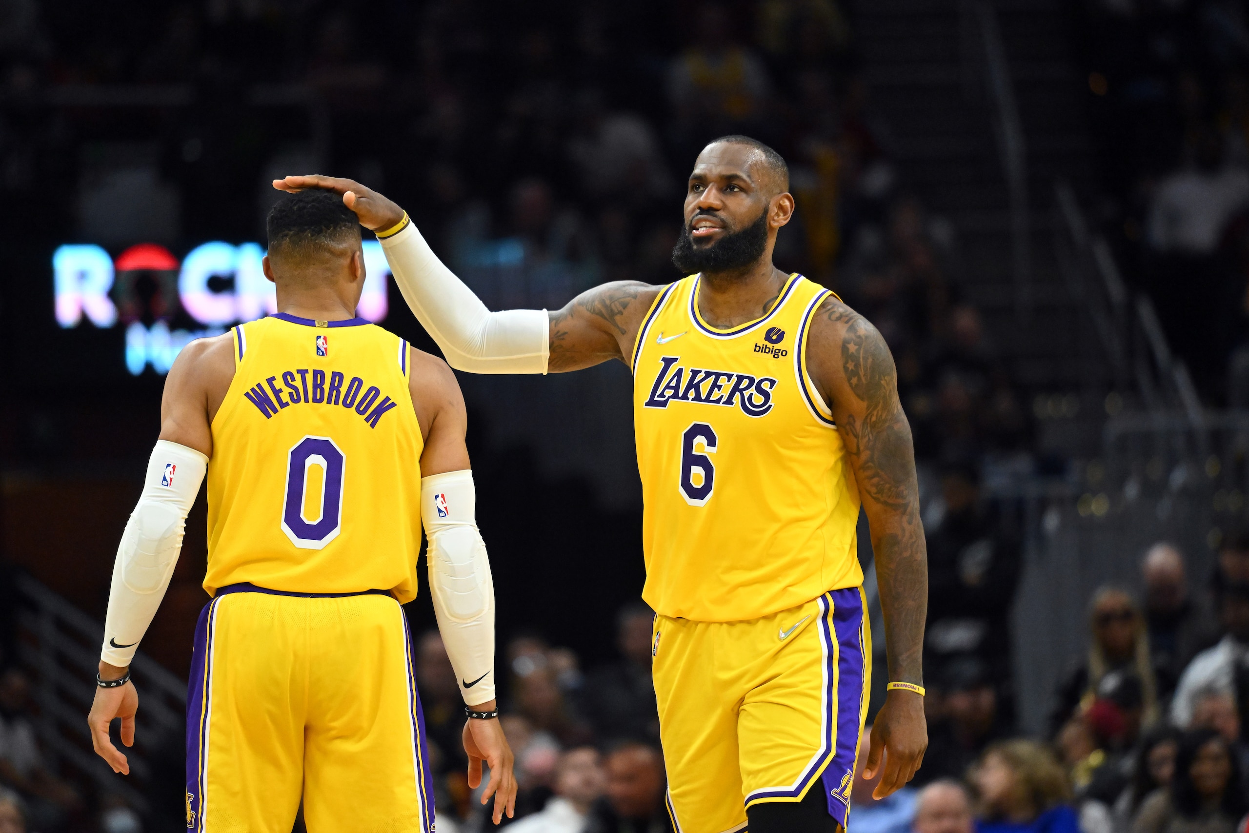 CLEVELAND, OHIO - MARCH 21: Russell Westbrook #0 celebrates with LeBron James #6 of the Los Angeles Lakers during the fourth quarter against the Cleveland Cavaliers at Rocket Mortgage Fieldhouse on March 21, 2022 in Cleveland, Ohio. The Lakers defeated the Cavaliers 131-120. NOTE TO USER: User expressly acknowledges and agrees that, by downloading and/or using this photograph, user is consenting to the terms and conditions of the Getty Images License Agreement. (Photo by Jason Miller/Getty Images)