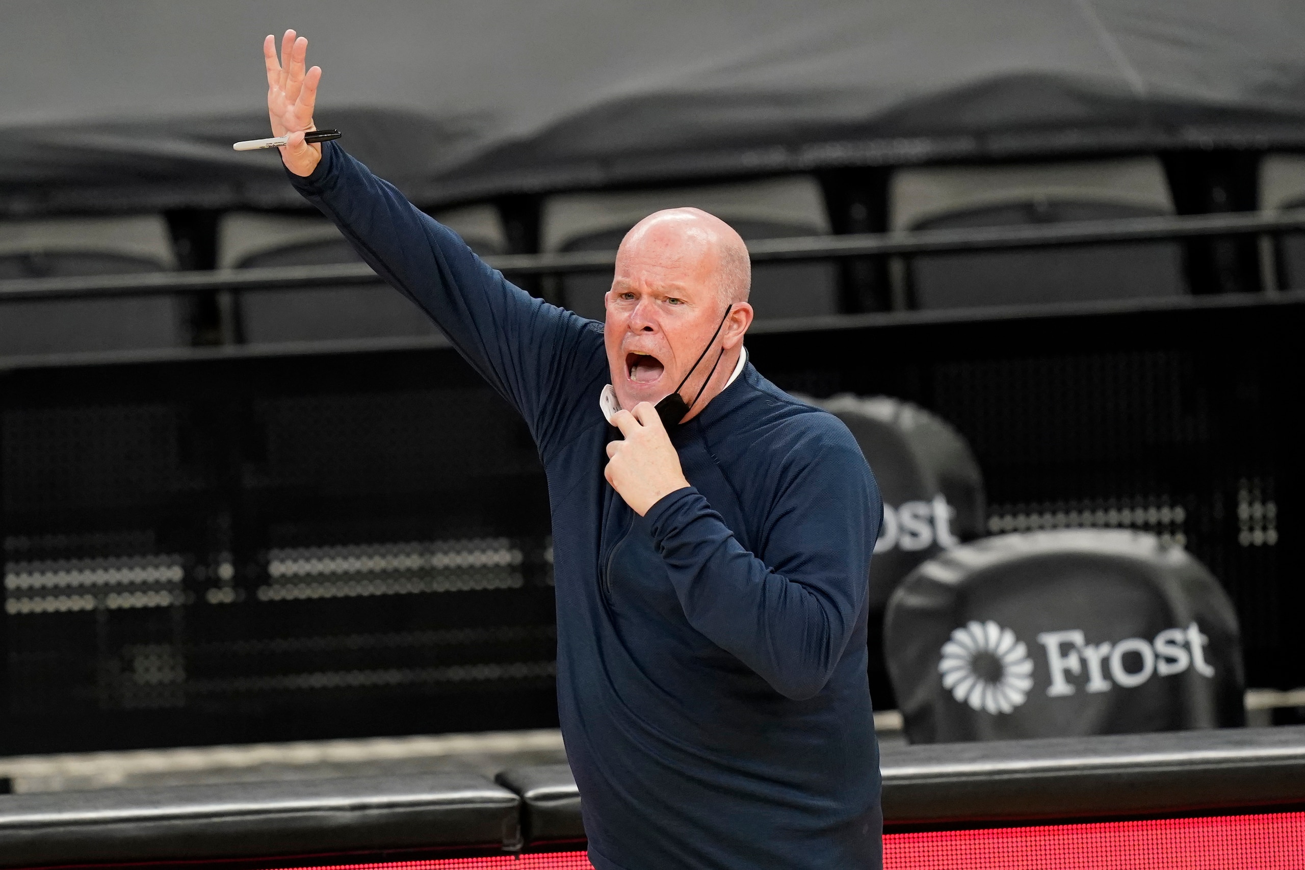 Orlando Magic head coach Steve Clifford gives direction to his team during the first half of an NBA basketball game against the San Antonio Spurs in San Antonio, Friday, March 12, 2021. (AP Photo/Eric Gay)