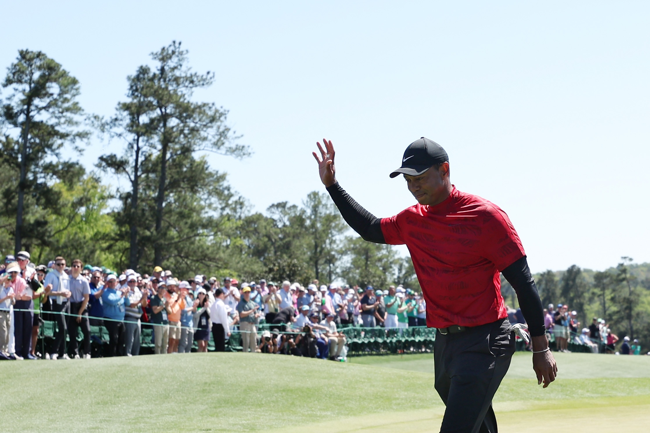 AUGUSTA, GEORGIA - APRIL 10: Tiger Woods waves to the crowd on the 18th green after finishing his round during the final round of the Masters at Augusta National Golf Club on April 10, 2022 in Augusta, Georgia. (Photo by Gregory Shamus/Getty Images)