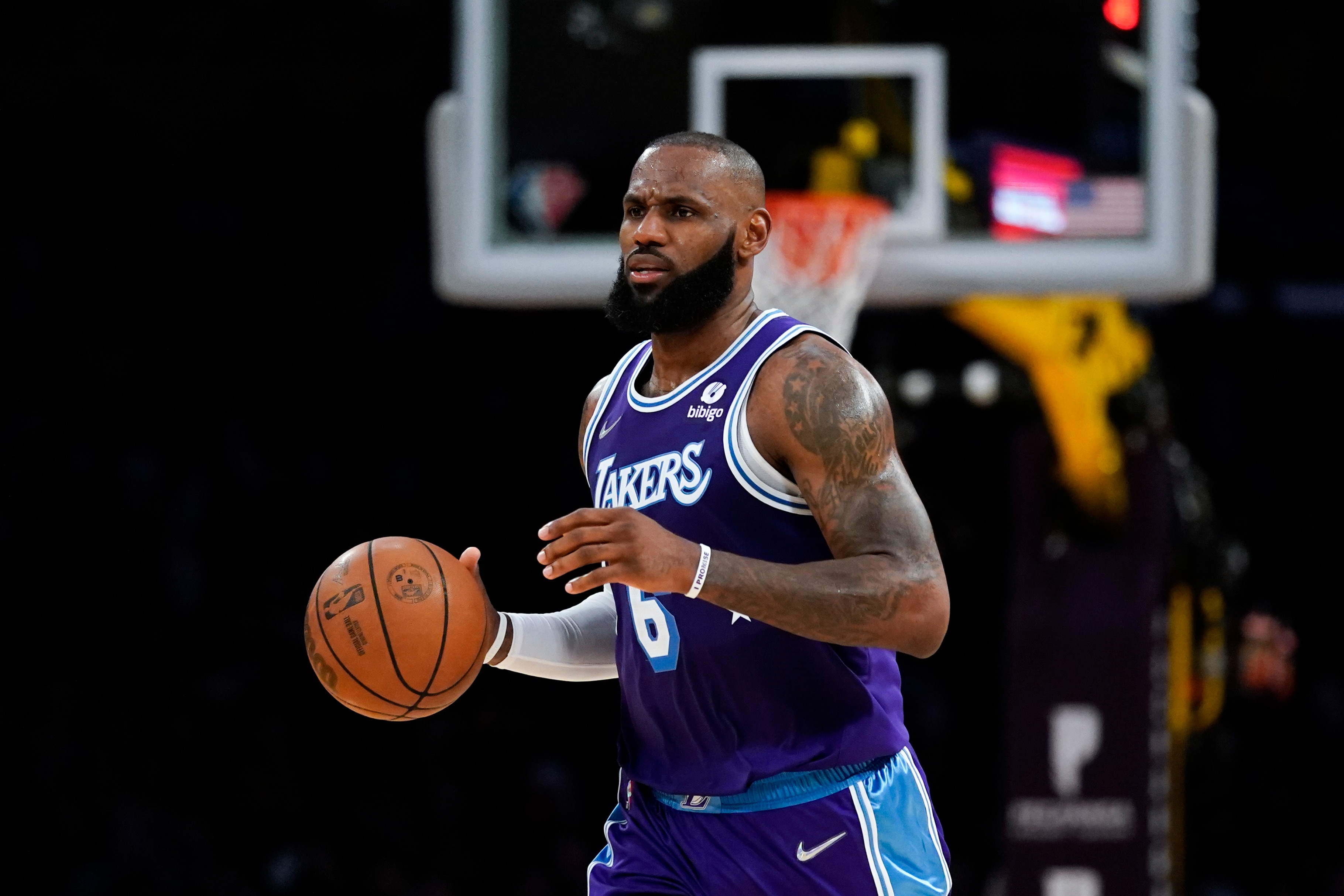 Los Angeles Lakers forward LeBron James (6) controls the ball during an NBA basketball game against the New Orleans Pelicans in Los Angeles, Friday, April 1, 2022. (AP Photo/Ashley Landis)