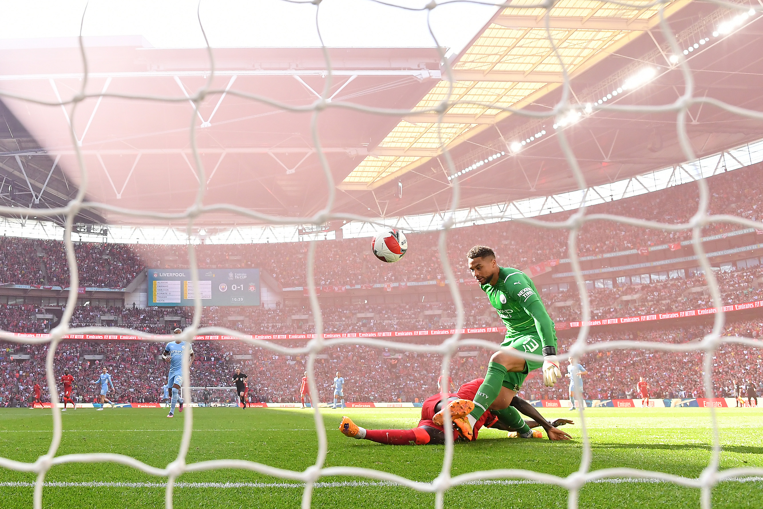 LONDON, ENGLAND - APRIL 16: Sadio Mane of Liverpool scores their side's second goal past Zack Steffen of Manchester City during The Emirates FA Cup Semi-Final match between Manchester City and Liverpool at Wembley Stadium on April 16, 2022 in London, England. (Photo by Justin Setterfield - The FA/The FA via Getty Images)