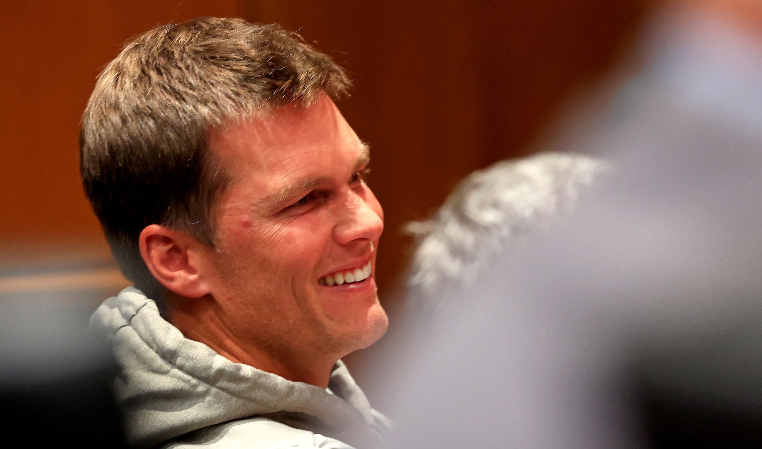 TAMPA, FLORIDA - MARCH 31: Tom Brady, quarterback for the Tampa Bay Buccaneers looks on during a press conference for new head coach Todd Bowles at AdventHealth Training Center on March 31, 2022 in Tampa, Florida. (Photo by Mike Ehrmann/Getty Images) TAMPA, FLORIDA - MARCH 31: Tom Brady, quarterback for the Tampa Bay Buccaneers looks on during a press conference for new head coach Todd Bowles at AdventHealth Training Center on March 31, 2022 in Tampa, Florida. (Photo by Mike Ehrmann/Getty Images)