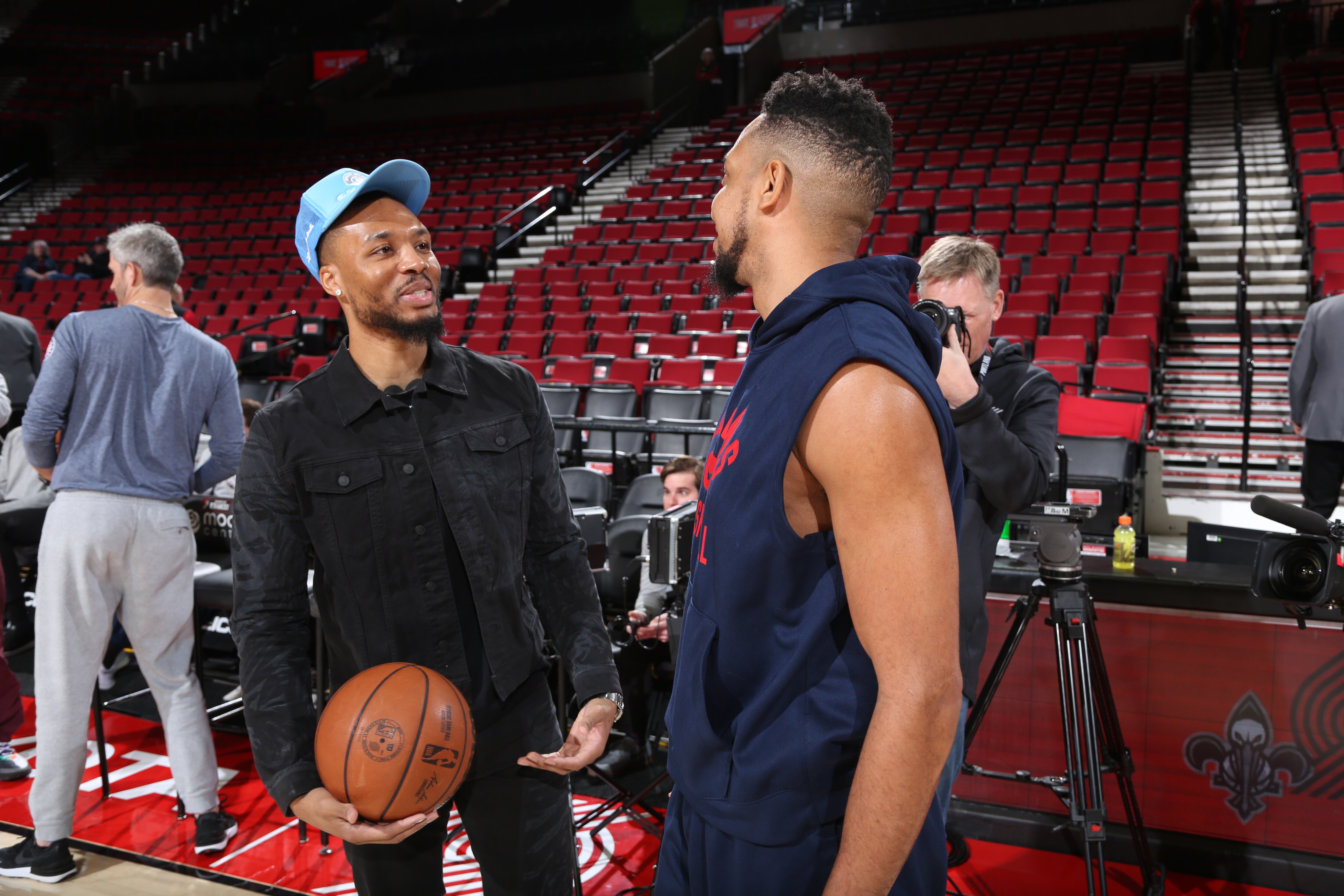 PORTLAND, OR - MARCH 30: Damian Lillard #0 of the Portland Trail Blazers and CJ McCollum #3 of the New Orleans Pelicans embrace before the game on March 30, 2022 at the Moda Center Arena in Portland, Oregon. NOTE TO USER: User expressly acknowledges and agrees that, by downloading and or using this photograph, user is consenting to the terms and conditions of the Getty Images License Agreement. Mandatory Copyright Notice: Copyright 2022 NBAE (Photo by Sam Forencich/NBAE via Getty Images)