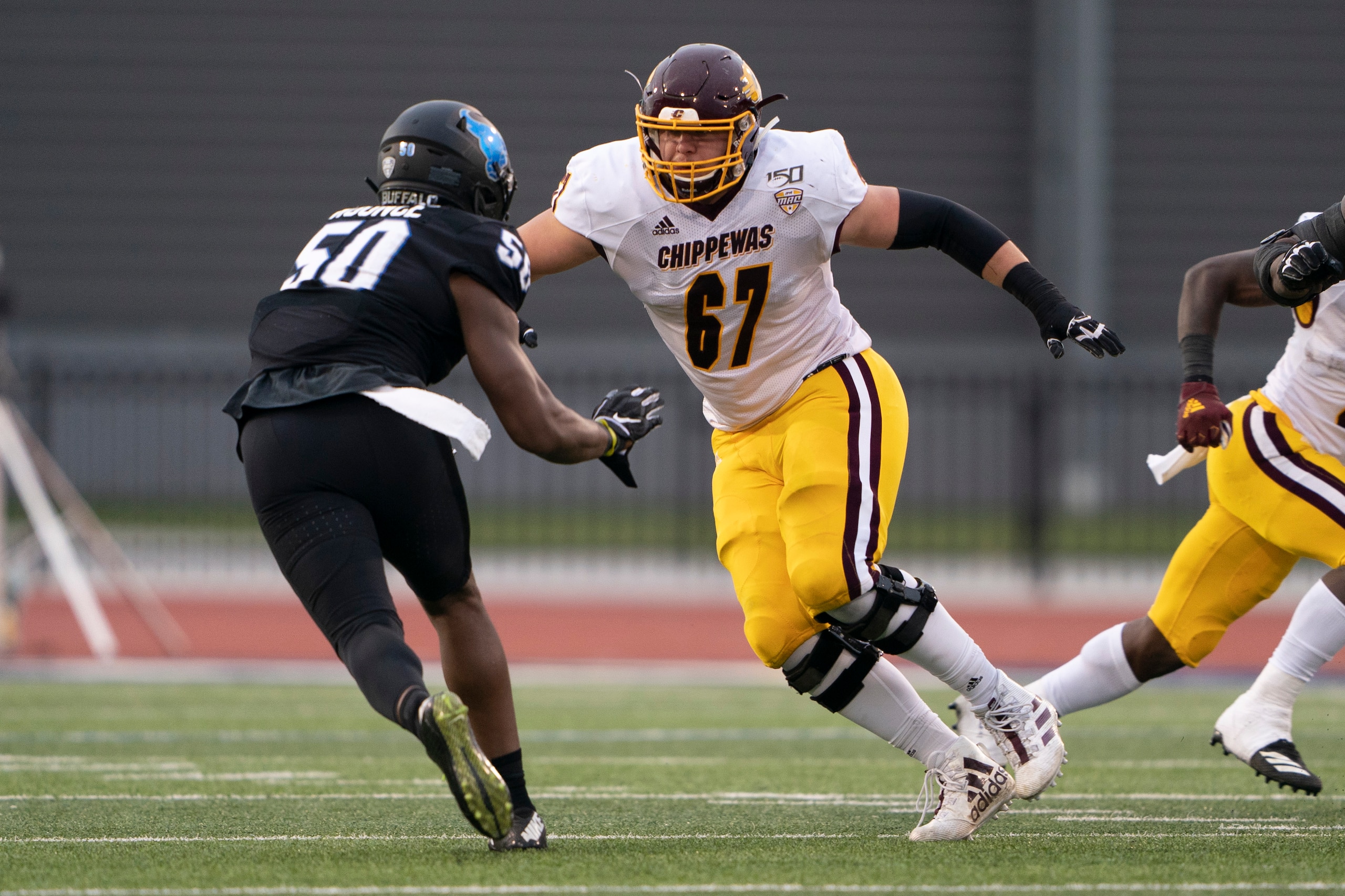 AMHERST, NY - OCTOBER 26: Central Michigan Chippewas Offensive Lineman Luke Goedeke (67) blocks Buffalo Bulls Place Defensive End Malcolm Koonce (50) during the second half of the game between the Central Michigan Chippewas and the Buffalo Bulls on October 26, 2019, at UB Stadium in Amherst, NY. (Photo by Gregory Fisher/Icon Sportswire via Getty Images) AMHERST, NY - OCTOBER 26: Central Michigan Chippewas Offensive Lineman Luke Goedeke (67) blocks Buffalo Bulls Place Defensive End Malcolm Koonce (50) during the second half of the game between the Central Michigan Chippewas and the Buffalo Bulls on October 26, 2019, at UB Stadium in Amherst, NY. (Photo by Gregory Fisher/Icon Sportswire via Getty Images)