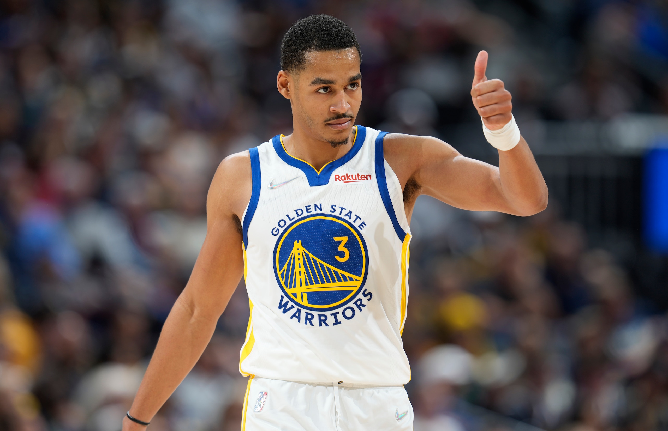Golden State Warriors guard Jordan Poole gestures to the bench during the second half of Game 3 of the team's NBA basketball first-round playoff series against the Denver Nuggets on Thursday, April 21, 2022, in Denver. (AP Photo/David Zalubowski)