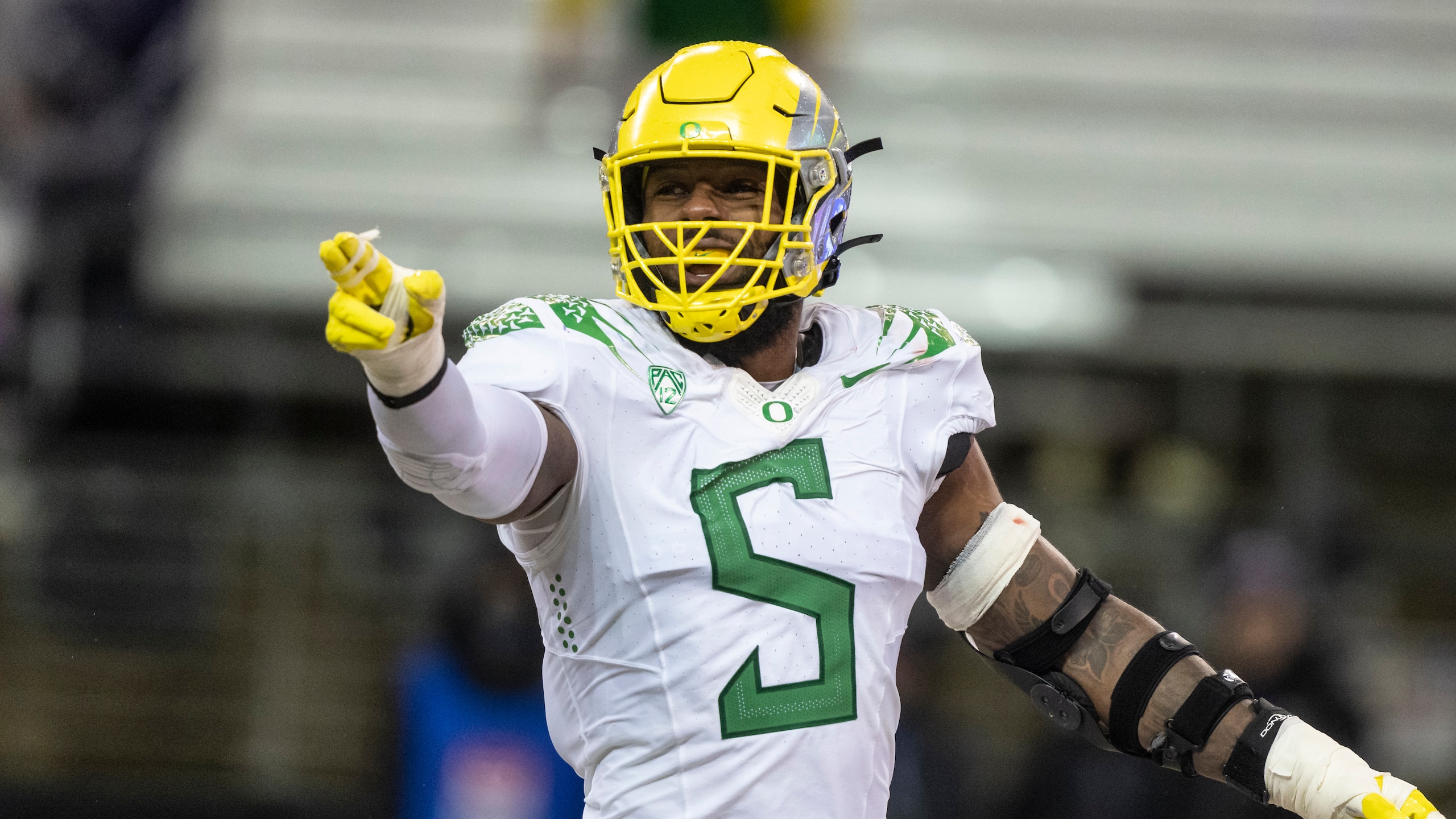 Oregon defensive end Kayvon Thibodeaux gestures during an NCAA college football game against Washington, Saturday, Nov. 6, 2021, in Seattle. Oregon won 26-16. (AP Photo/Stephen Brashear) Oregon defensive end Kayvon Thibodeaux gestures during an NCAA college football game against Washington, Saturday, Nov. 6, 2021, in Seattle. Oregon won 26-16. (AP Photo/Stephen Brashear)