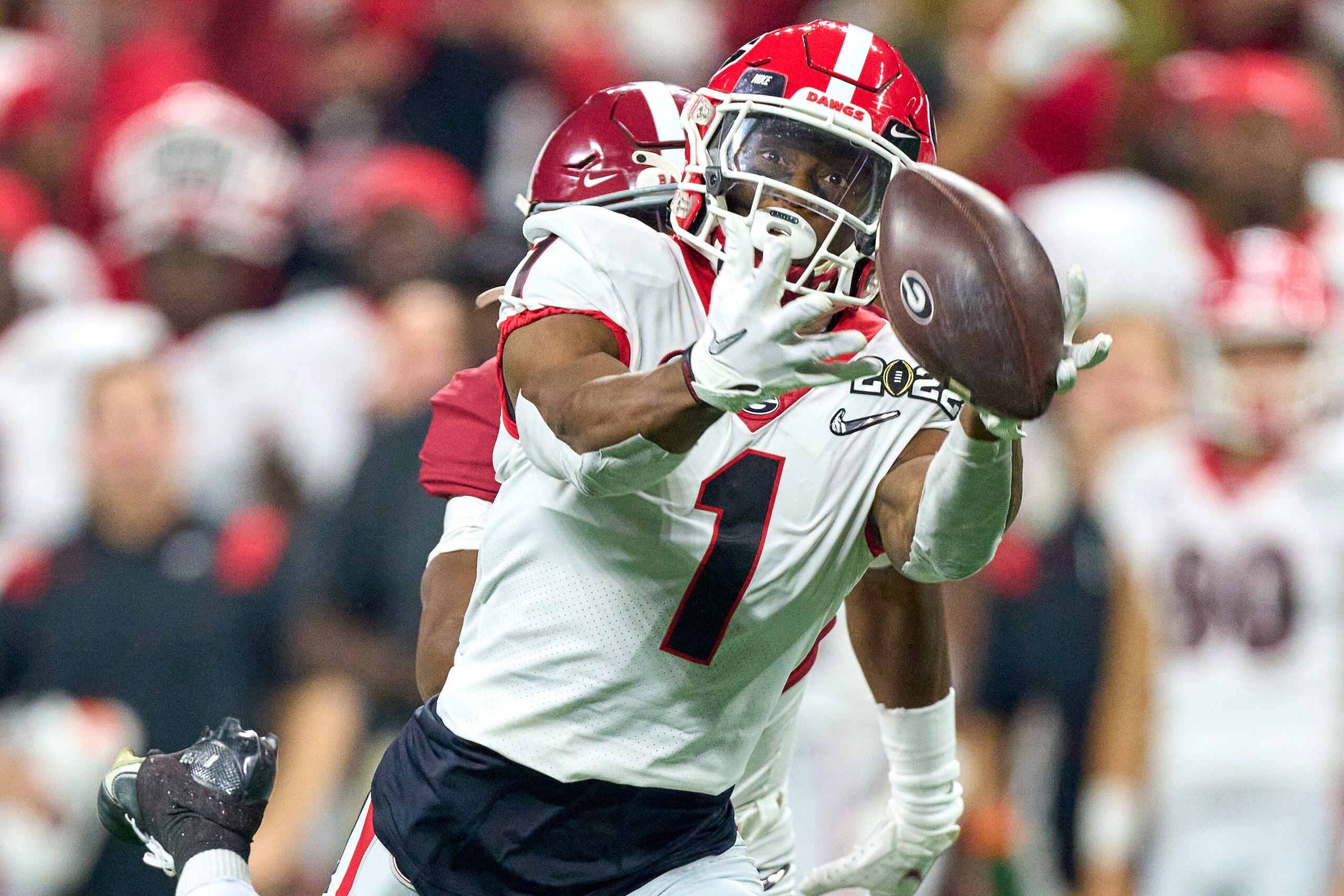 INDIANAPOLIS, IN - JANUARY 10: Georgia Bulldogs WR George Pickens (1) catches a deep pass defended by Alabama Crimson Tide DB Kool-Aid McKinstry (1) during the Alabama Crimson Tide versus the Georgia Bulldogs in the College Football Playoff National Championship, on January 10, 2022, at Lucas Oil Stadium in Indianapolis, IN.(Photo by Robin Alam/Icon Sportswire via Getty Images)