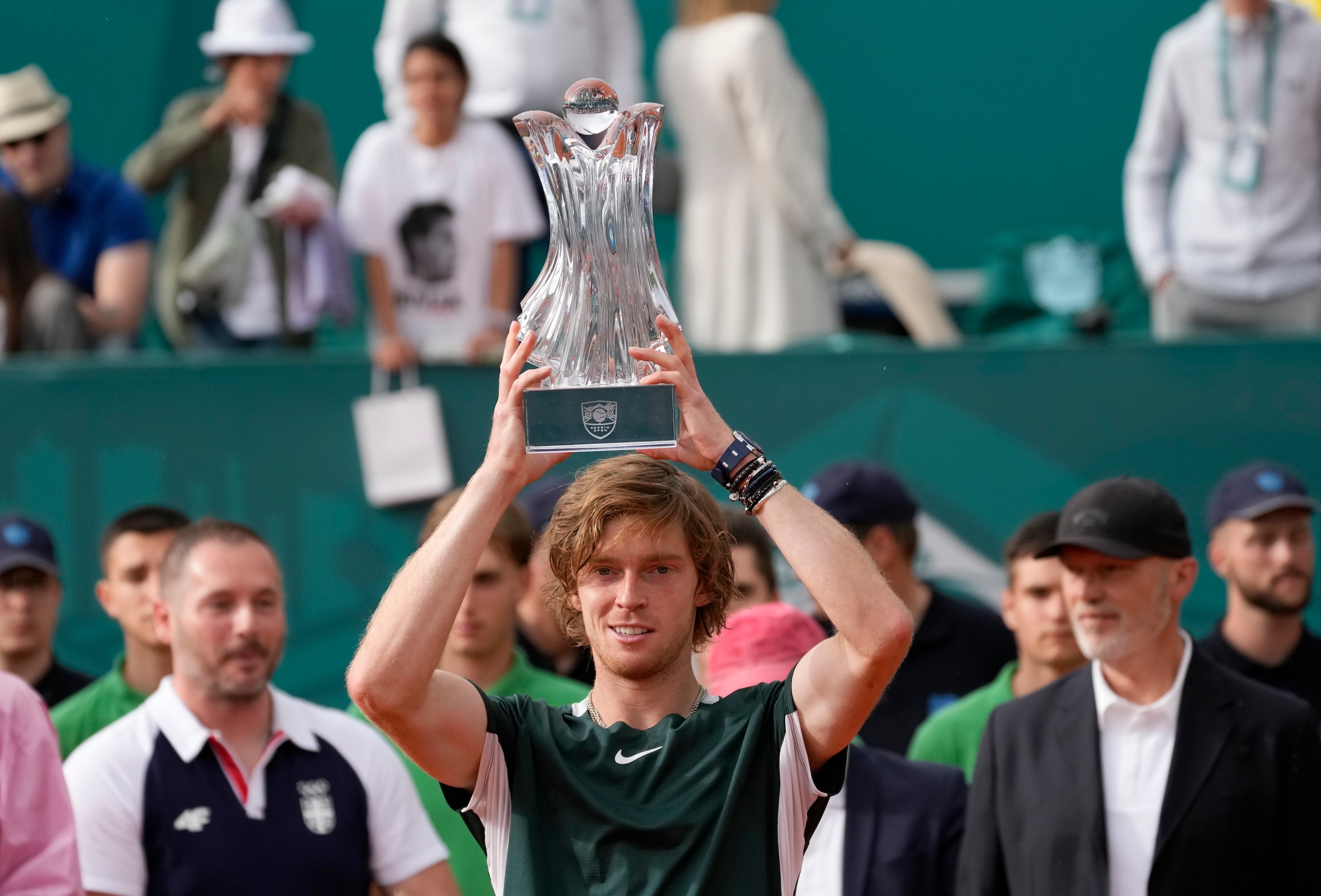 Andrey Rublev of Russia poses with trophy after winning the final tennis match of the Serbia Open tennis tournament against Novak Djokovic of Serbia, in Belgrade, Serbia, Sunday, April 24, 2022. (AP Photo/Darko Vojinovic)