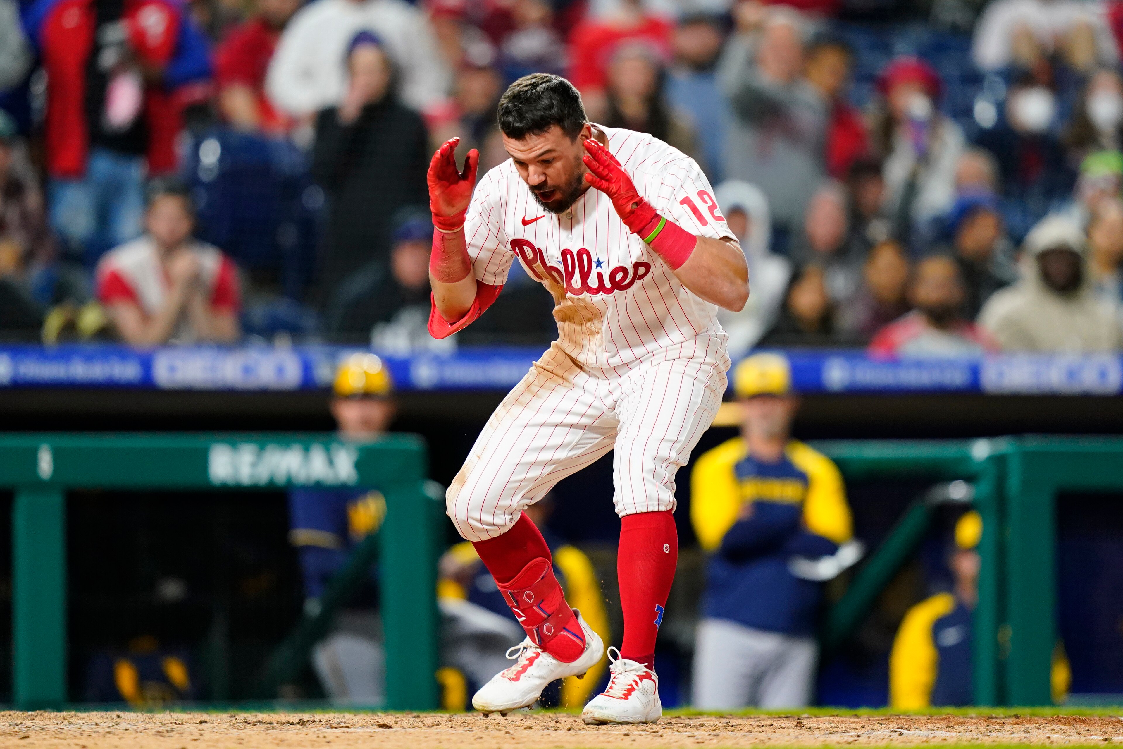 Philadelphia Phillies' Kyle Schwarber reacts after striking out against Milwaukee Brewers pitcher Josh Hader during the ninth inning of a baseball game, Sunday, April 24, 2022, in Philadelphia. (AP Photo/Matt Slocum)