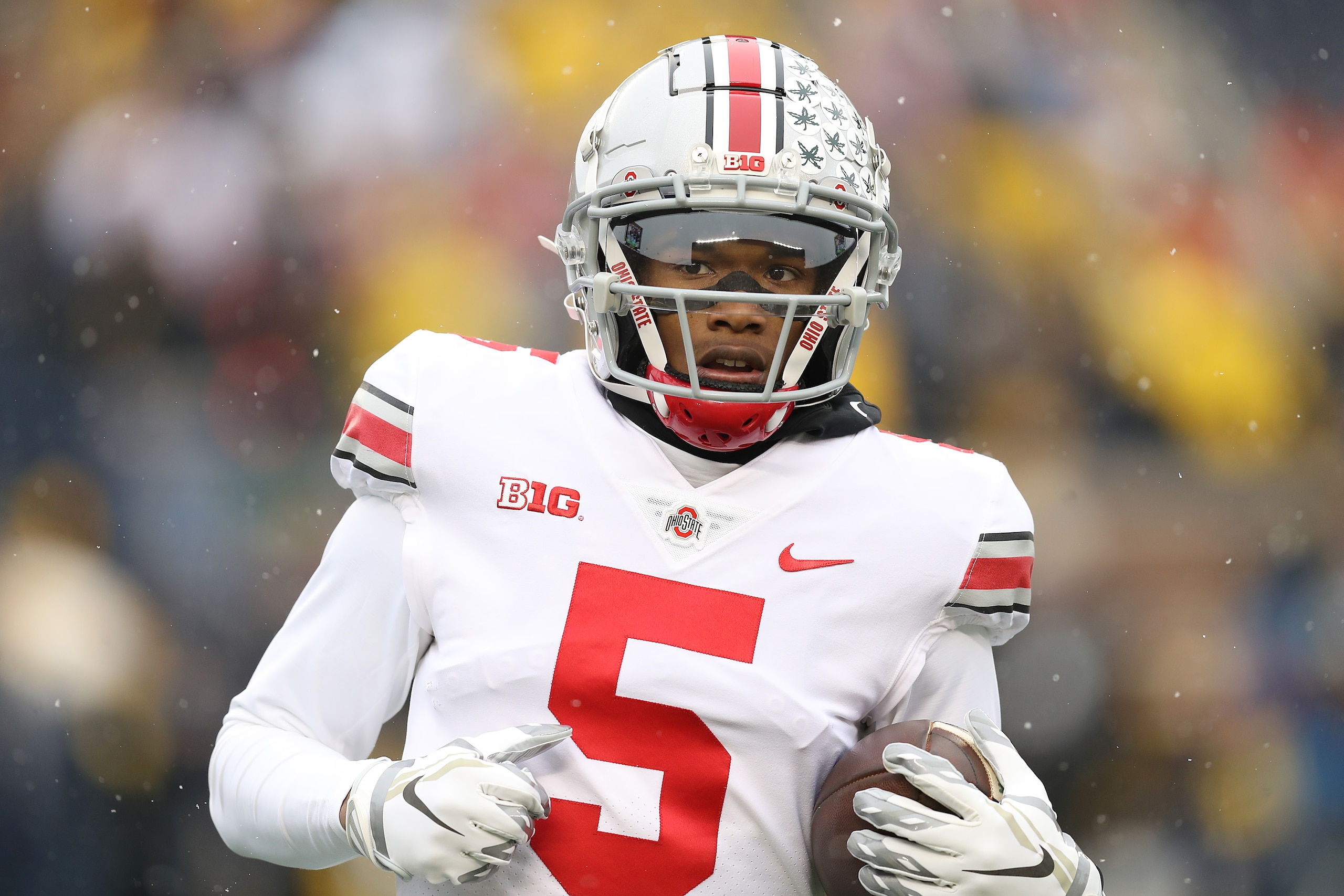 ANN ARBOR, MICHIGAN - NOVEMBER 27: Garrett Wilson #5 of the Ohio State Buckeyes warms up prior to the game against the Michigan Wolverines at Michigan Stadium on November 27, 2021 in Ann Arbor, Michigan. (Photo by Mike Mulholland/Getty Images) ANN ARBOR, MICHIGAN - NOVEMBER 27: Garrett Wilson #5 of the Ohio State Buckeyes warms up prior to the game against the Michigan Wolverines at Michigan Stadium on November 27, 2021 in Ann Arbor, Michigan. (Photo by Mike Mulholland/Getty Images)