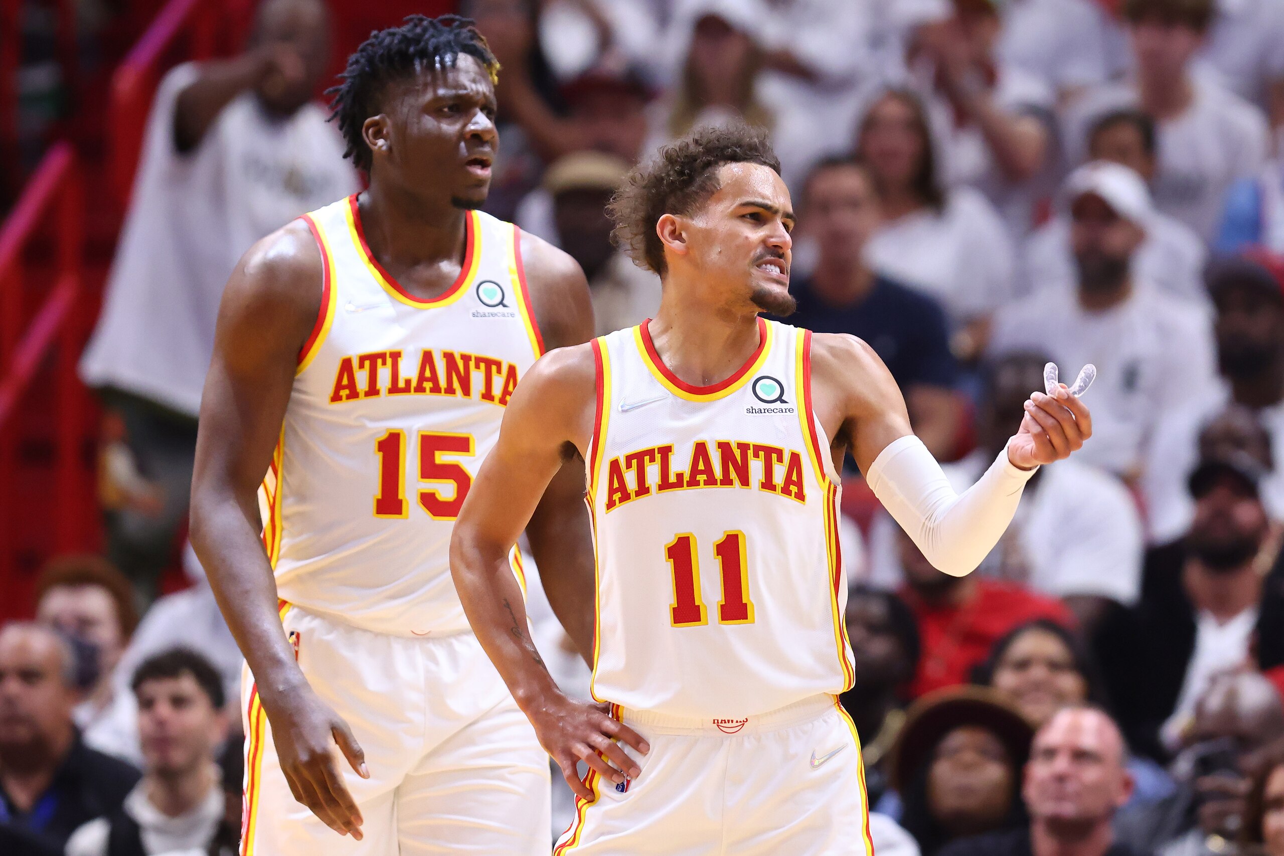MIAMI, FLORIDA - APRIL 26: Clint Capela #15 and Trae Young #11 of the Atlanta Hawks react against the Miami Heat during the first half in Game Five of the Eastern Conference First Round at FTX Arena on April 26, 2022 in Miami, Florida. NOTE TO USER: User expressly acknowledges and agrees that, by downloading and or using this photograph, User is consenting to the terms and conditions of the Getty Images License Agreement. (Photo by Michael Reaves/Getty Images) MIAMI, FLORIDA - APRIL 26: Clint Capela #15 and Trae Young #11 of the Atlanta Hawks react against the Miami Heat during the first half in Game Five of the Eastern Conference First Round at FTX Arena on April 26, 2022 in Miami, Florida. NOTE TO USER: User expressly acknowledges and agrees that, by downloading and or using this photograph, User is consenting to the terms and conditions of the Getty Images License Agreement. (Photo by Michael Reaves/Getty Images)