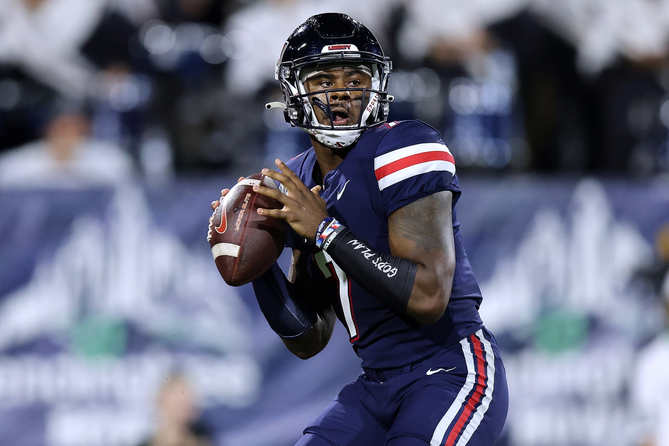 MOBILE, ALABAMA - DECEMBER 18: Malik Willis #7 of the Liberty Flames throws the the ball during the LendingTree Bowl at Hancock Whitney Stadium on December 18, 2021 in Mobile, Alabama. (Photo by Jonathan Bachman/Getty Images)