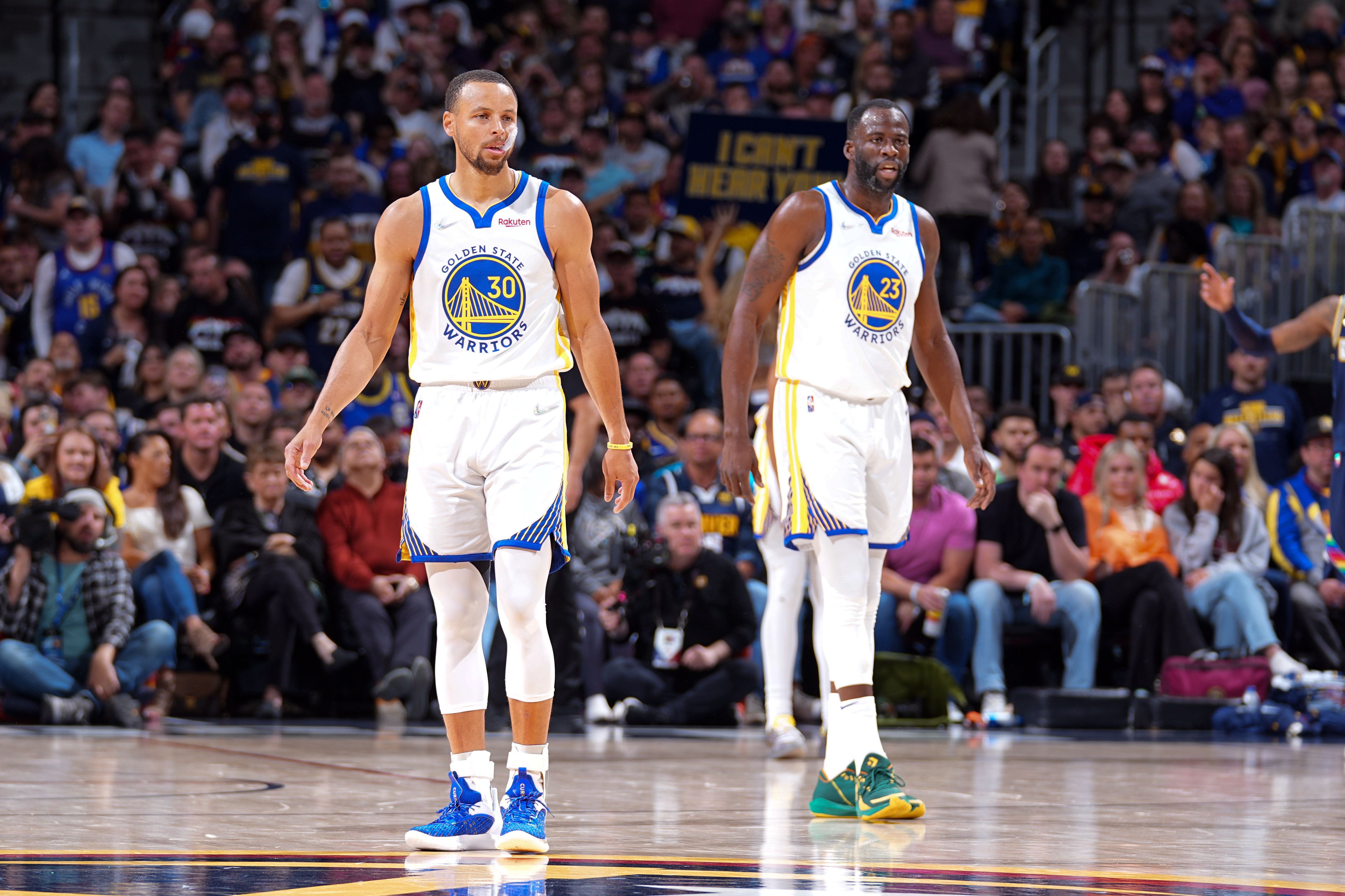DENVER, CO - APRIL 24: Stephen Curry #30 and Draymond Green #23 of the Golden State Warriors look on against the Denver Nuggets during Round 1 Game 4 of the 2022 NBA Playoffs on April 24, 2022 at the Ball Arena in Denver, Colorado. NOTE TO USER: User expressly acknowledges and agrees that, by downloading and/or using this Photograph, user is consenting to the terms and conditions of the Getty Images License Agreement. Mandatory Copyright Notice: Copyright 2022 NBAE (Photo by Bart Young/NBAE via Getty Images)