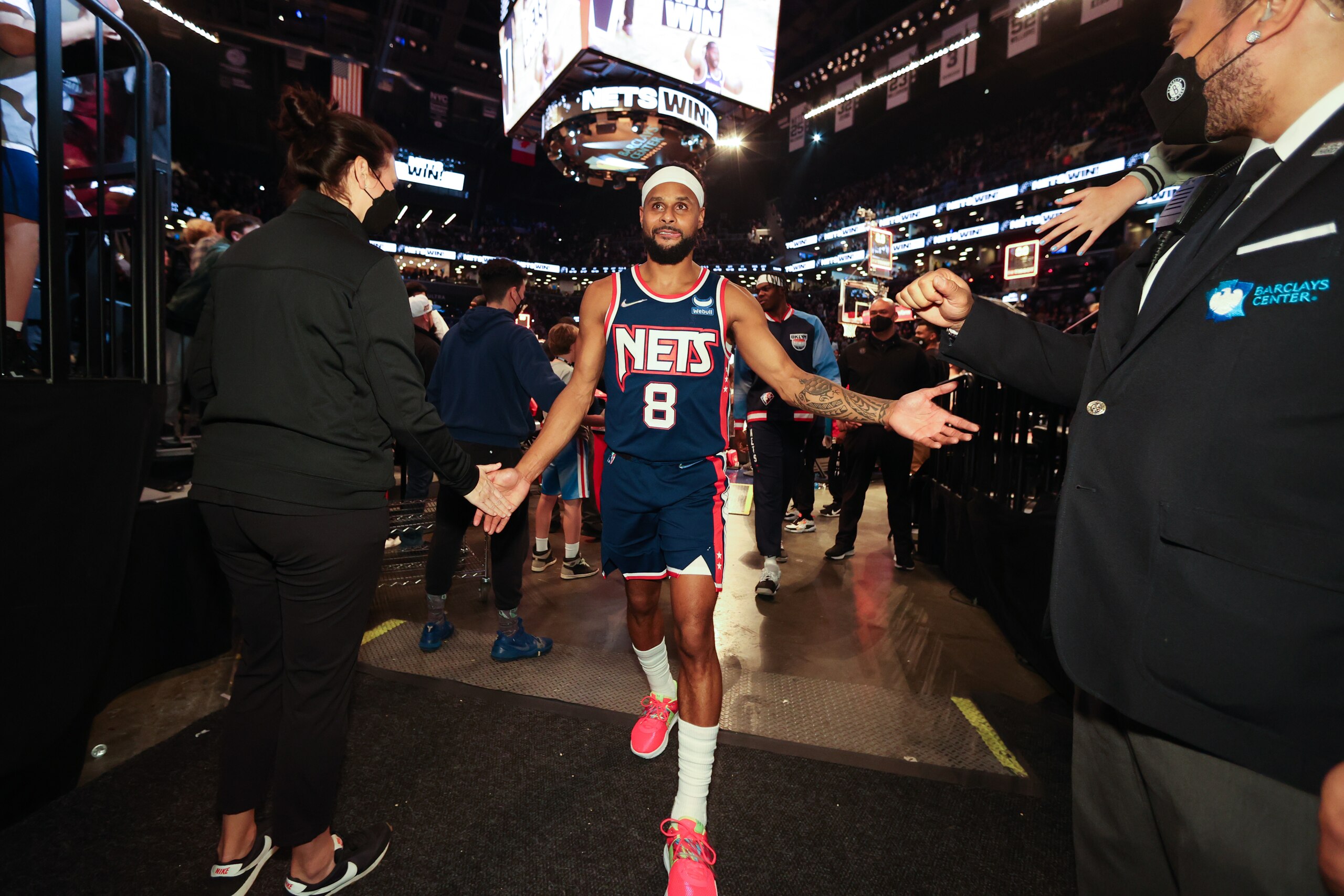 BROOKLYN, NY - APRIL 8: Patty Mills #8 of the Brooklyn Nets hi-fives fans after the game against the Cleveland Cavaliers on April 8, 2022 at Barclays Center in Brooklyn, New York. NOTE TO USER: User expressly acknowledges and agrees that, by downloading and or using this Photograph, user is consenting to the terms and conditions of the Getty Images License Agreement. Mandatory Copyright Notice: Copyright 2022 NBAE (Photo by Nathaniel S. Butler/NBAE via Getty Images)