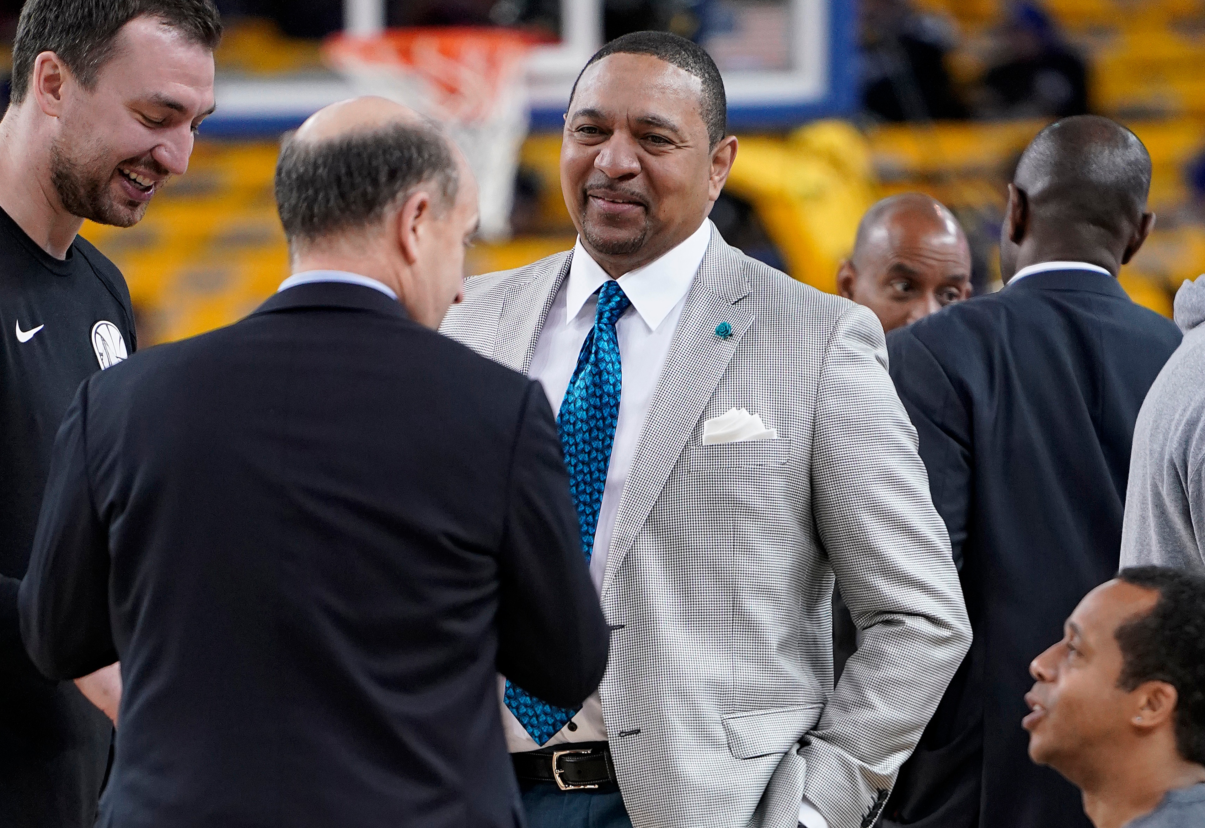 Mark Jackson, center, talks with Jeff Van Gundy, second from left, and others before Game 4 of basketball's NBA Finals between the Golden State Warriors and the Toronto Raptors in Oakland, Calif., Friday, June 7, 2019. ABC/ESPN NBA analyst Jackson credits faith, confidence and longtime friendships with Van Gundy and Mike Breen as the main catalysts for his longevity and why he is working his 12th NBA Finals. (AP Photo/Tony Avelar) Mark Jackson, center, talks with Jeff Van Gundy, second from left, and others before Game 4 of basketball's NBA Finals between the Golden State Warriors and the Toronto Raptors in Oakland, Calif., Friday, June 7, 2019. ABC/ESPN NBA analyst Jackson credits faith, confidence and longtime friendships with Van Gundy and Mike Breen as the main catalysts for his longevity and why he is working his 12th NBA Finals. (AP Photo/Tony Avelar)