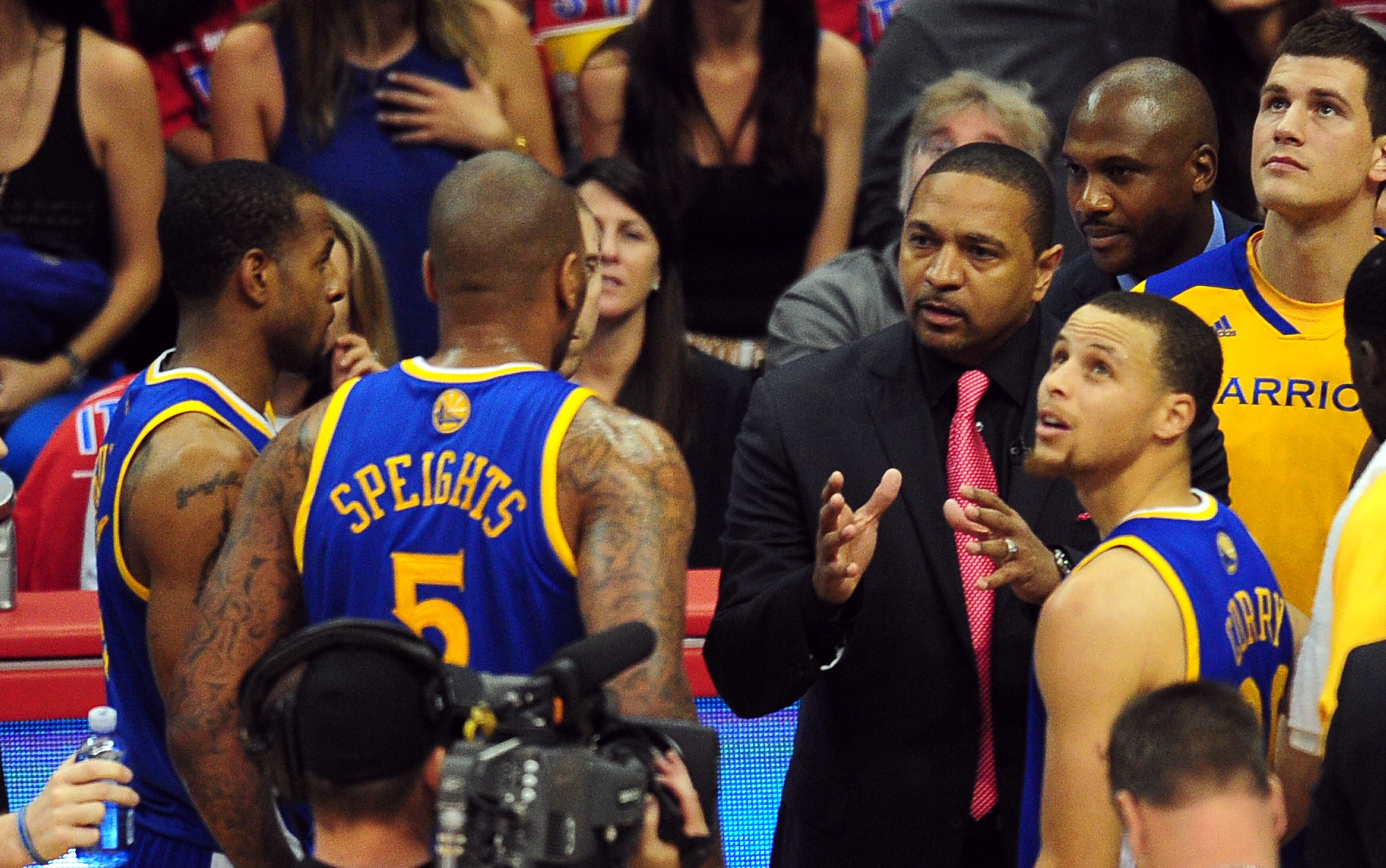 Golden State Warriors coach Mark Jackson has a word with his players between the action against the Los Angeles Clippers during  game 7 of their NBA first round series on May 3, 2014 in Los Angeles, California. AFP PHOTO / Frederic J. BROWN        (Photo credit should read FREDERIC J. BROWN/AFP via Getty Images)