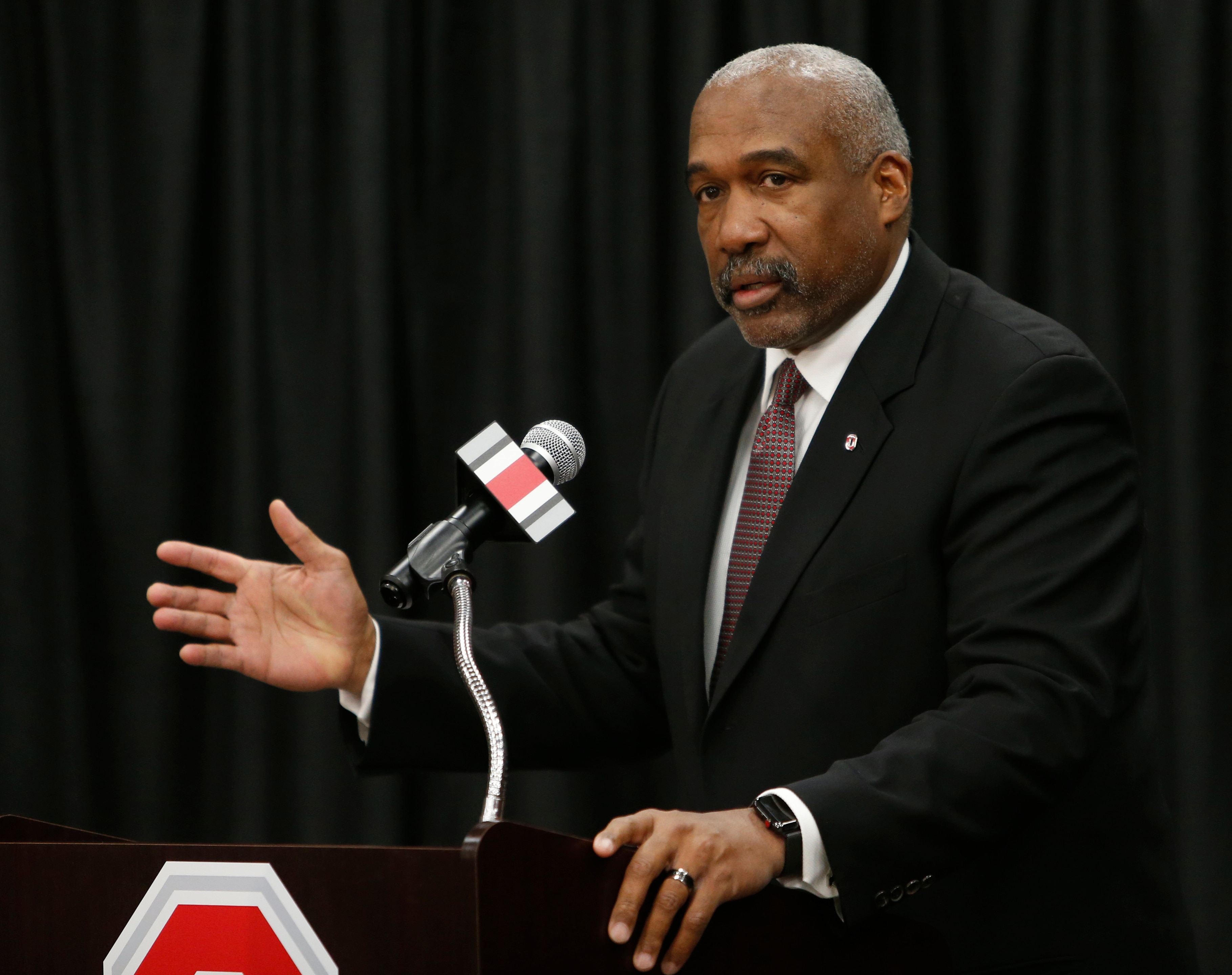 Ohio State athletics director Gene Smith answers questions during a news conference, Tuesday, Dec. 4, 2018, in Columbus, Ohio. Ohio State's athletic department will cut 25 jobs, furlough hundreds of other employees and ask coaches and others to take 5% pay cuts to help grapple with a projected $107 million budget deficit due to the COVID-19 pandemic, athletic director Gene Smith said Wednesday, Sept. 23, 2020. (AP Photo/Jay LaPrete)