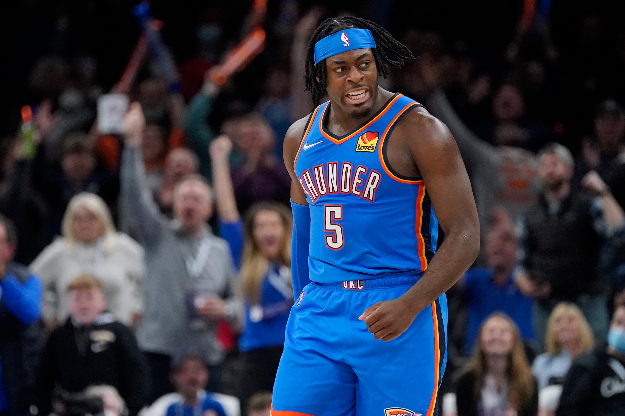 Oklahoma City Thunder forward Luguentz Dort celebrates after a three-point basket in the second half of an NBA basketball game against the Chicago Bulls, Monday, Jan. 24, 2022, in Oklahoma City. (AP Photo/Sue Ogrocki)
