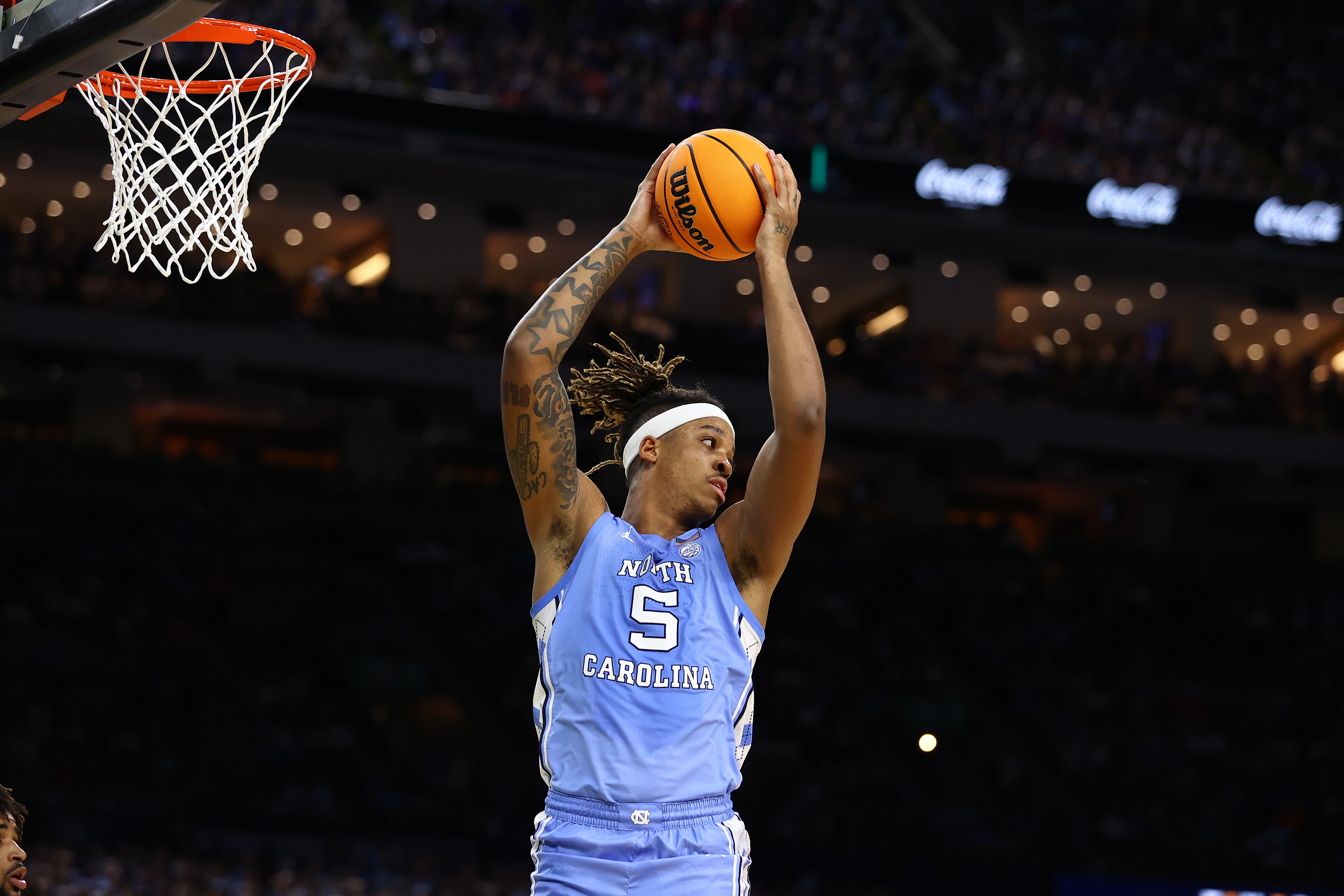 NEW ORLEANS, LOUISIANA - APRIL 04: Armando Bacot #5 of the North Carolina Tar Heels grabs a rebound against the Kansas Jayhawks during the second half of the 2022 NCAA Men's Basketball Tournament National Championship game at Caesars Superdome on April 04, 2022 in New Orleans, Louisiana. (Photo by Jamie Schwaberow/NCAA Photos via Getty Images)