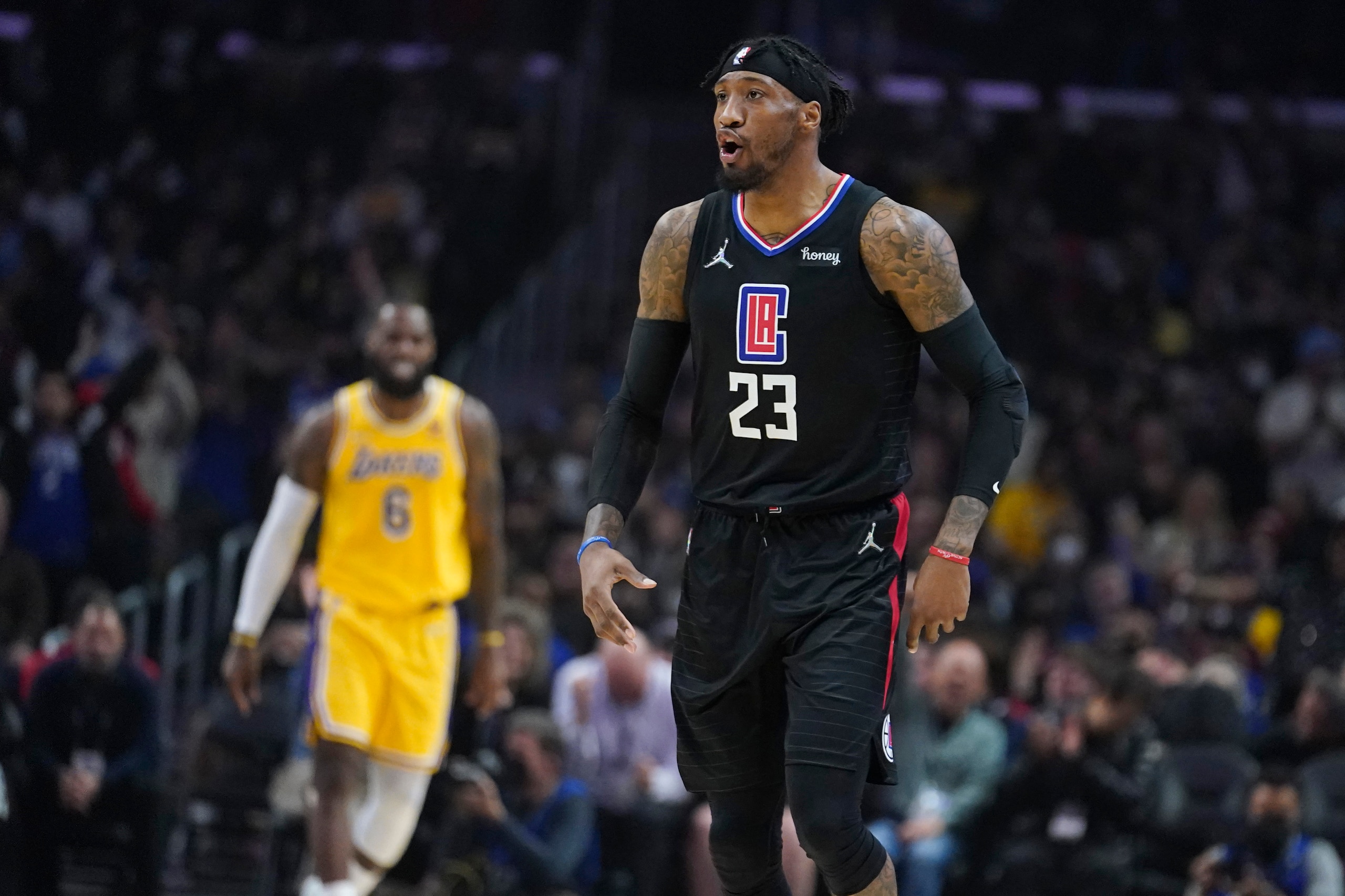 Los Angeles Clippers forward Robert Covington (23) celebrates after making a 3-point basket during the first half of the team's NBA basketball game against the Los Angeles Lakers on Thursday, March 3, 2022, in Los Angeles. (AP Photo/Marcio Jose Sanchez) Los Angeles Clippers forward Robert Covington (23) celebrates after making a 3-point basket during the first half of the team's NBA basketball game against the Los Angeles Lakers on Thursday, March 3, 2022, in Los Angeles. (AP Photo/Marcio Jose Sanchez)