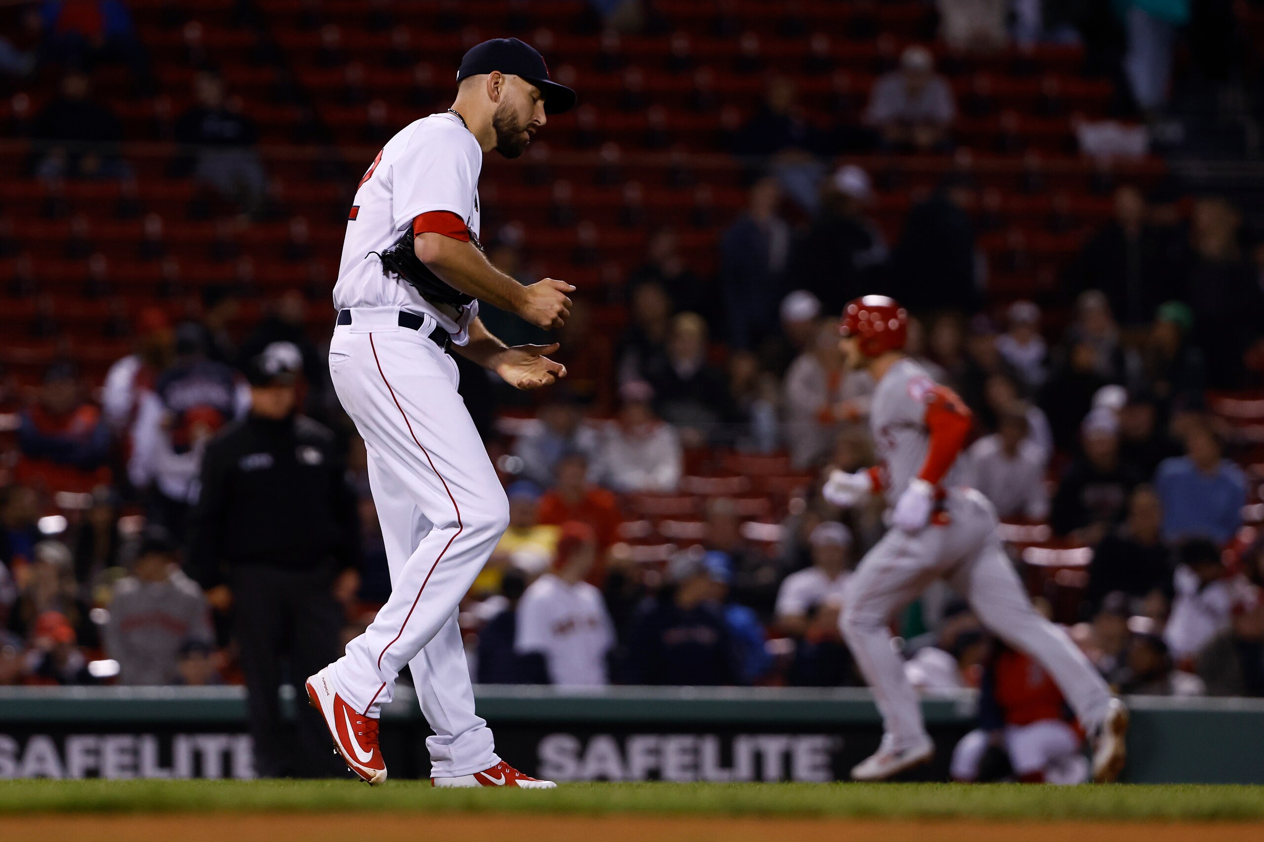 Boston Red Sox relief pitcher Matt Barnes walks off the mound as Los Angeles Angels' Taylor Ward runs the bases on a two-run home run during the 10th inning of a baseball game Wednesday, May 4, 2022, at Fenway Park in Boston. (AP Photo/Winslow Townson)