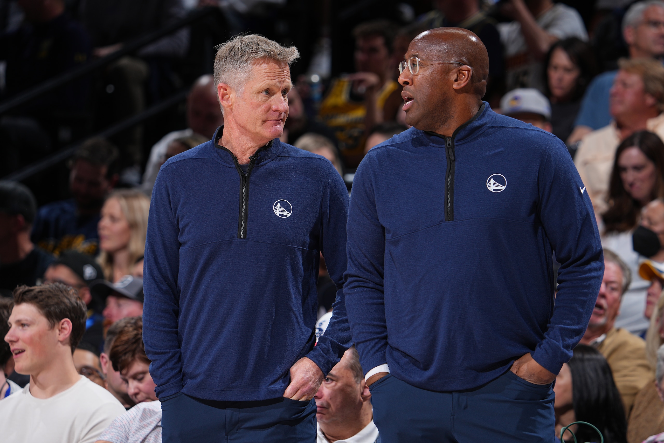 DENVER, CO - APRIL 21: Head Coach Steve Kerr of the Golden State Warriors talks to Assistant Coach Mike Brown during the game against the Denver Nuggets during Round 1 Game 3 of the 2022 NBA Playoffs on April 21, 2022 at the Ball Arena in Denver, Colorado. NOTE TO USER: User expressly acknowledges and agrees that, by downloading and/or using this Photograph, user is consenting to the terms and conditions of the Getty Images License Agreement. Mandatory Copyright Notice: Copyright 2022 NBAE (Photo by Bart Young/NBAE via Getty Images)