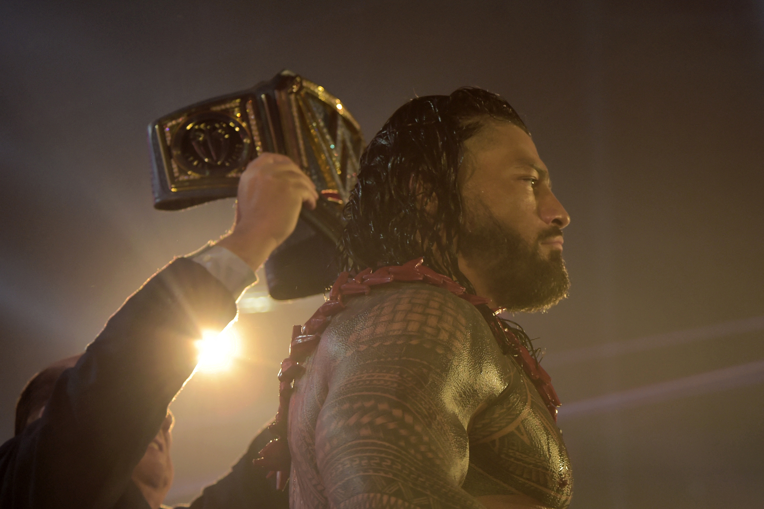 Roman Reigns wins a match during the 2022 WWE Elimination Chamber at the Jeddah Super Dome in Saudi Arabia's Red Sea coastal city of Jeddah on February 19, 2022. (Photo by Amer HILABI / AFP) (Photo by AMER HILABI/AFP via Getty Images)