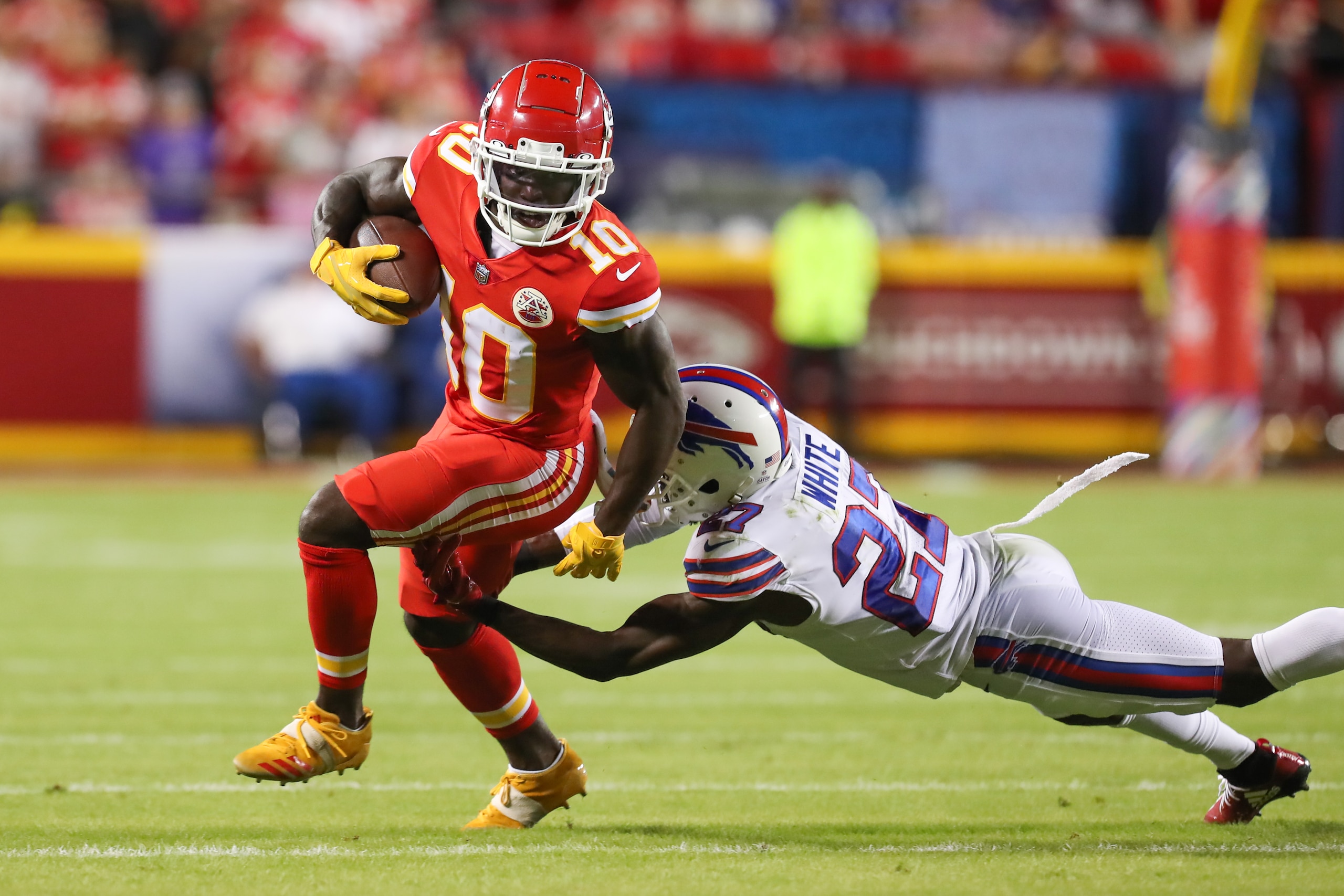 KANSAS CITY, MO - OCTOBER 10: Buffalo Bills cornerback Tre'Davious White (27) dives to try and tackle Kansas City Chiefs wide receiver Tyreek Hill (10) in the second quarter of an NFL football game between the Buffalo Bills and Kansas City Chiefs on Oct 10, 2021 at GEHA Filed at Arrowhead Stadium in Kansas City, MO. (Photo by Scott Winters/Icon Sportswire via Getty Images)