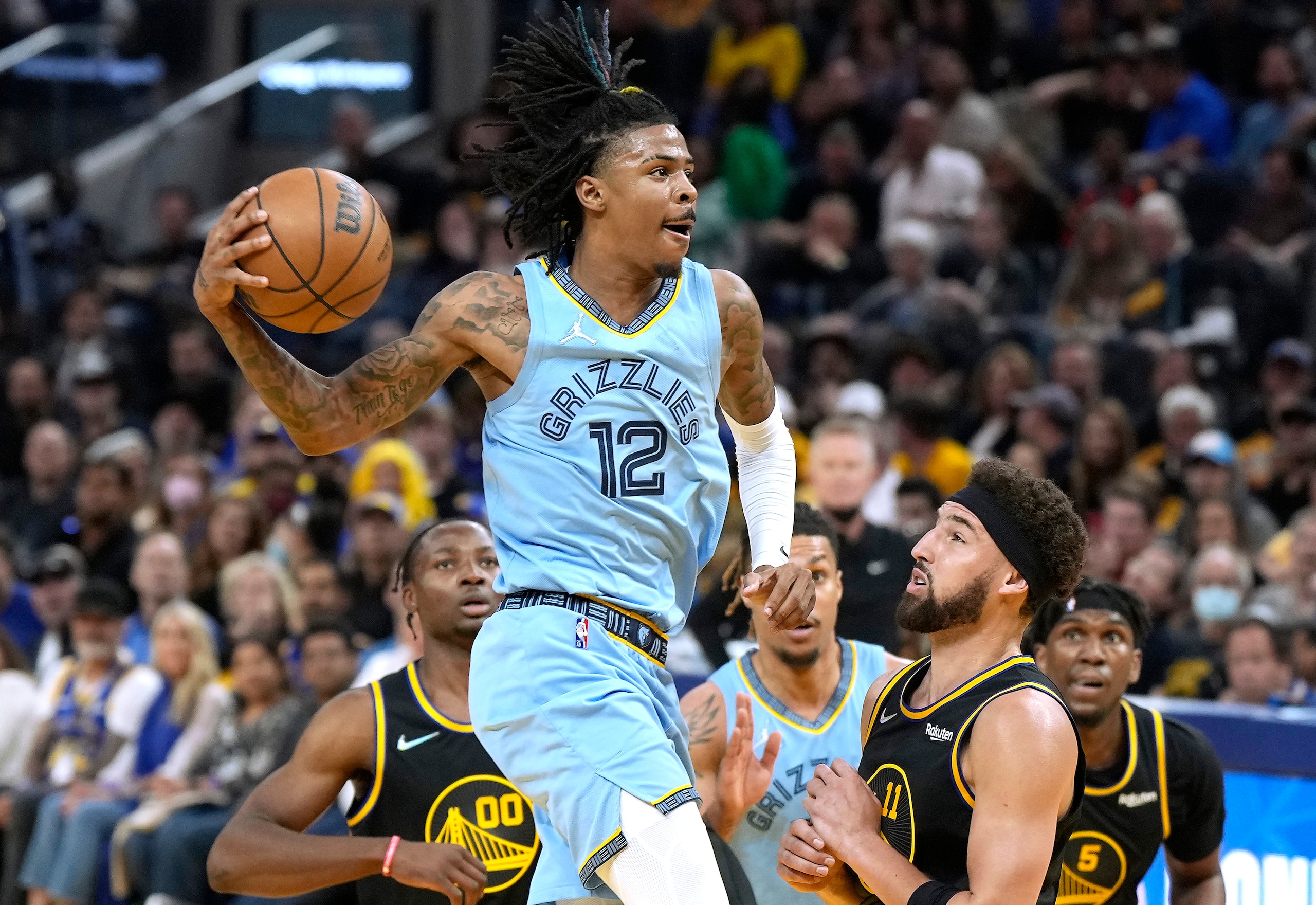 SAN FRANCISCO, CALIFORNIA - MAY 07: Ja Morant #12 of the Memphis Grizzlies drives to the basket to shoot against the Golden State Warriors in the second half of Game Three of the Western Conference Semifinals of the NBA Playoffs at Chase Center on May 07, 2022 in San Francisco, California. NOTE TO USER: User expressly acknowledges and agrees that, by downloading and or using this photograph, User is consenting to the terms and conditions of the Getty Images License Agreement. (Photo by Thearon W. Henderson/Getty Images)
