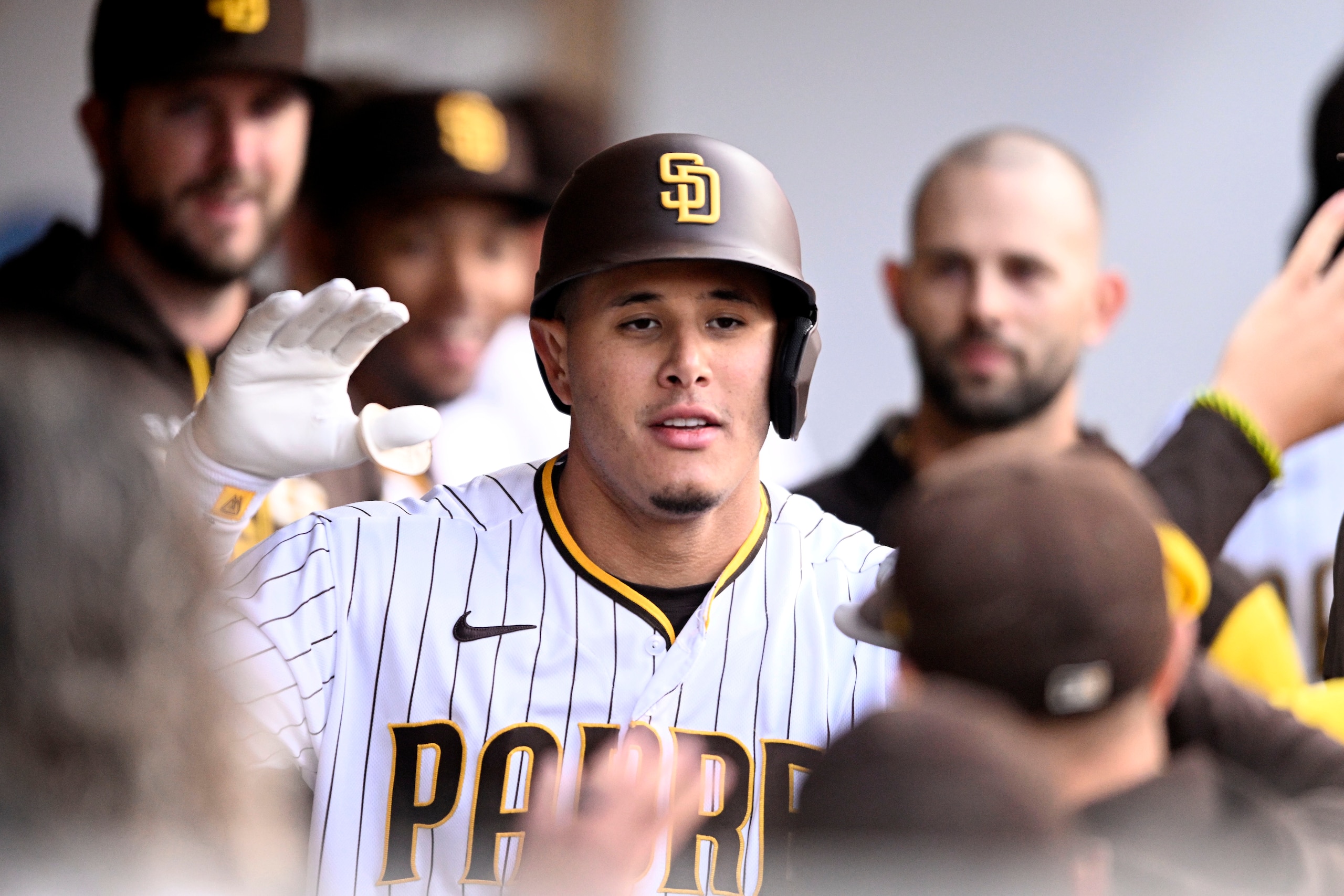 SAN DIEGO, CA - MAY 5 : Manny Machado #13 of the San Diego Padres is congratulated after he hit a solo home run during the first inning of a baseball game against the Miami Marlins on May 5, 2022 at Petco Park in San Diego, California. (Photo by Denis Poroy/Getty Images)