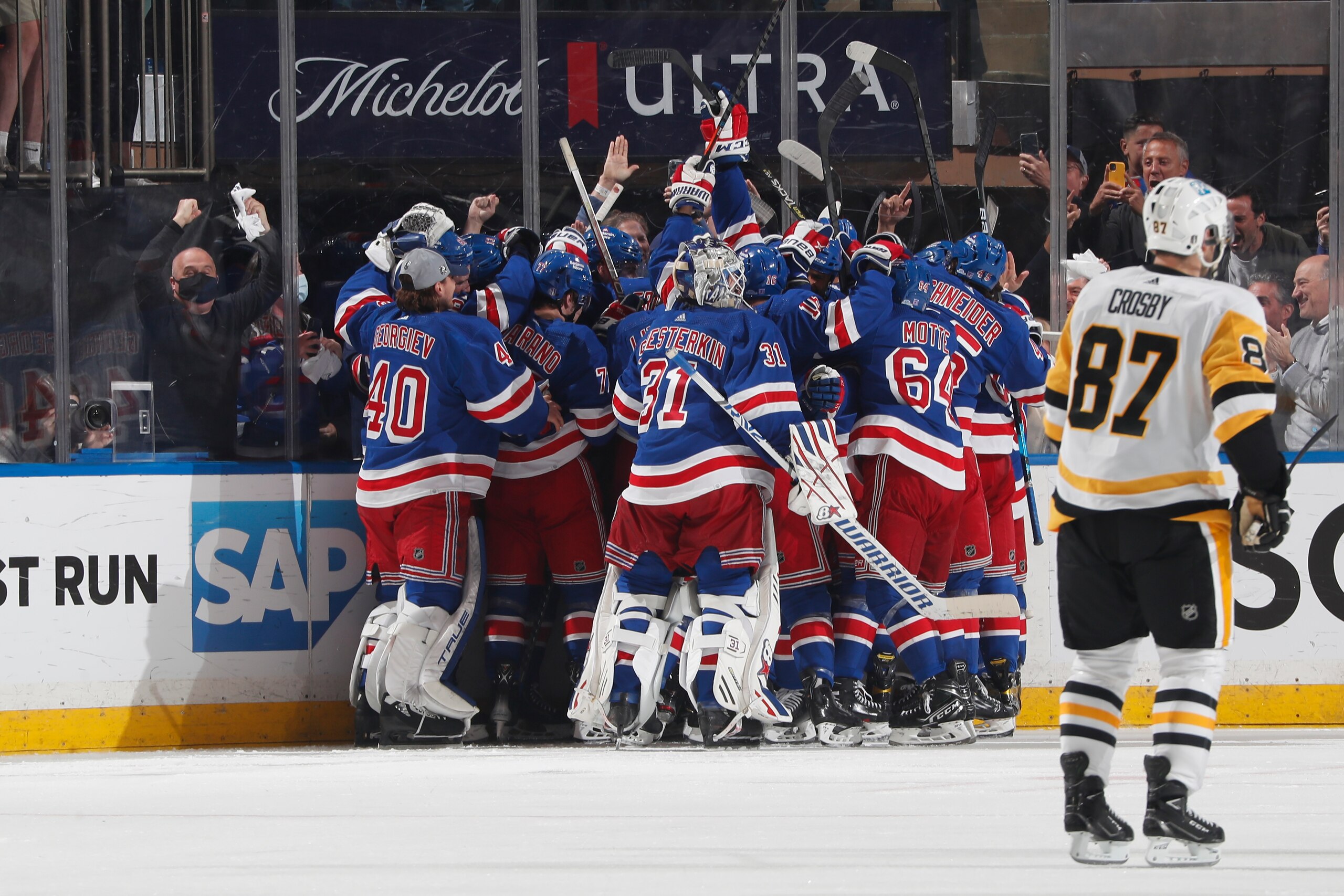 NEW YORK, NY - MAY 15: The New York Rangers celebrate a 4-3 overtime victory against the Pittsburgh Penguins in Game Seven of the First Round of the 2022 Stanley Cup Playoffs at Madison Square Garden on May 15, 2022 in New York City. (Photo by Jared Silber/NHLI via Getty Images)