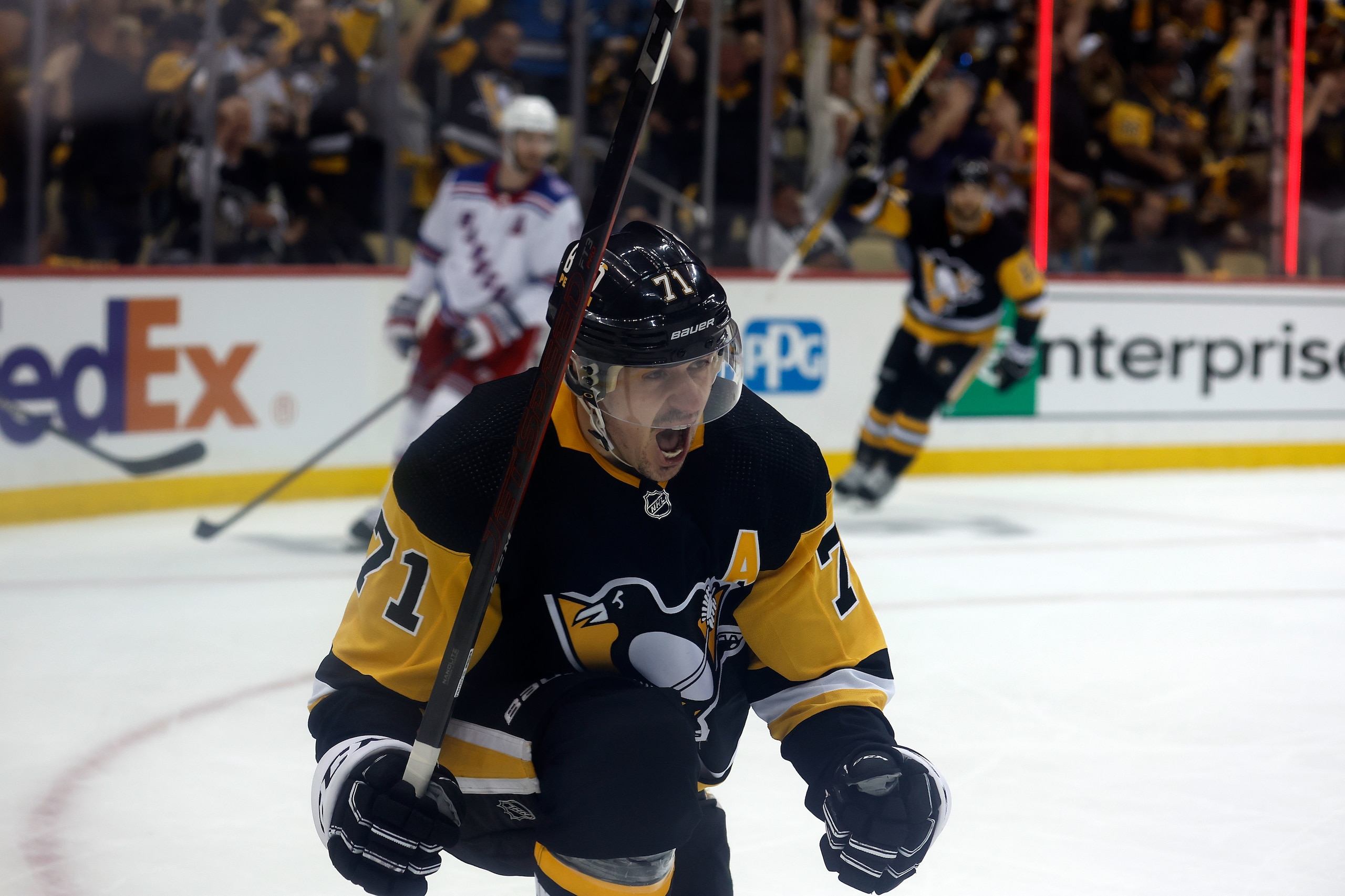 PITTSBURGH, PA - MAY 13: Evgeni Malkin #71 of the Pittsburgh Penguins reacts after scoring a goal in Game Six of the First Round of the 2022 Stanley Cup Playoffs against the New York Rangers at PPG PAINTS Arena on May 13, 2022 in Pittsburgh, Pennsylvania. (Photo by Kirk Irwin/Getty Images) PITTSBURGH, PA - MAY 13: Evgeni Malkin #71 of the Pittsburgh Penguins reacts after scoring a goal in Game Six of the First Round of the 2022 Stanley Cup Playoffs against the New York Rangers at PPG PAINTS Arena on May 13, 2022 in Pittsburgh, Pennsylvania. (Photo by Kirk Irwin/Getty Images)