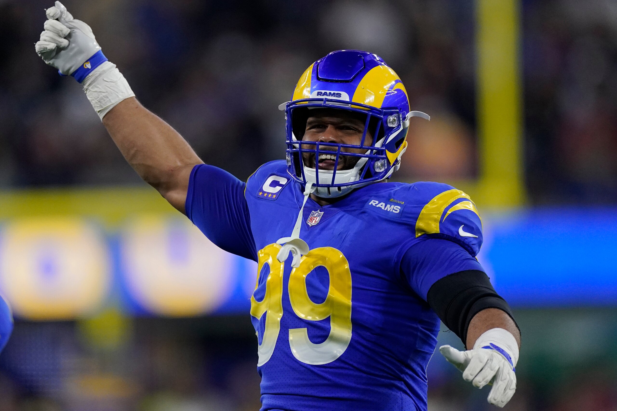 Los Angeles Rams defensive end Aaron Donald (99) celebrates during the first half of an NFL wild-card playoff football game against the Arizona Cardinals in Inglewood, Calif., Monday, Jan. 17, 2022. (AP Photo/Mark J. Terrill)