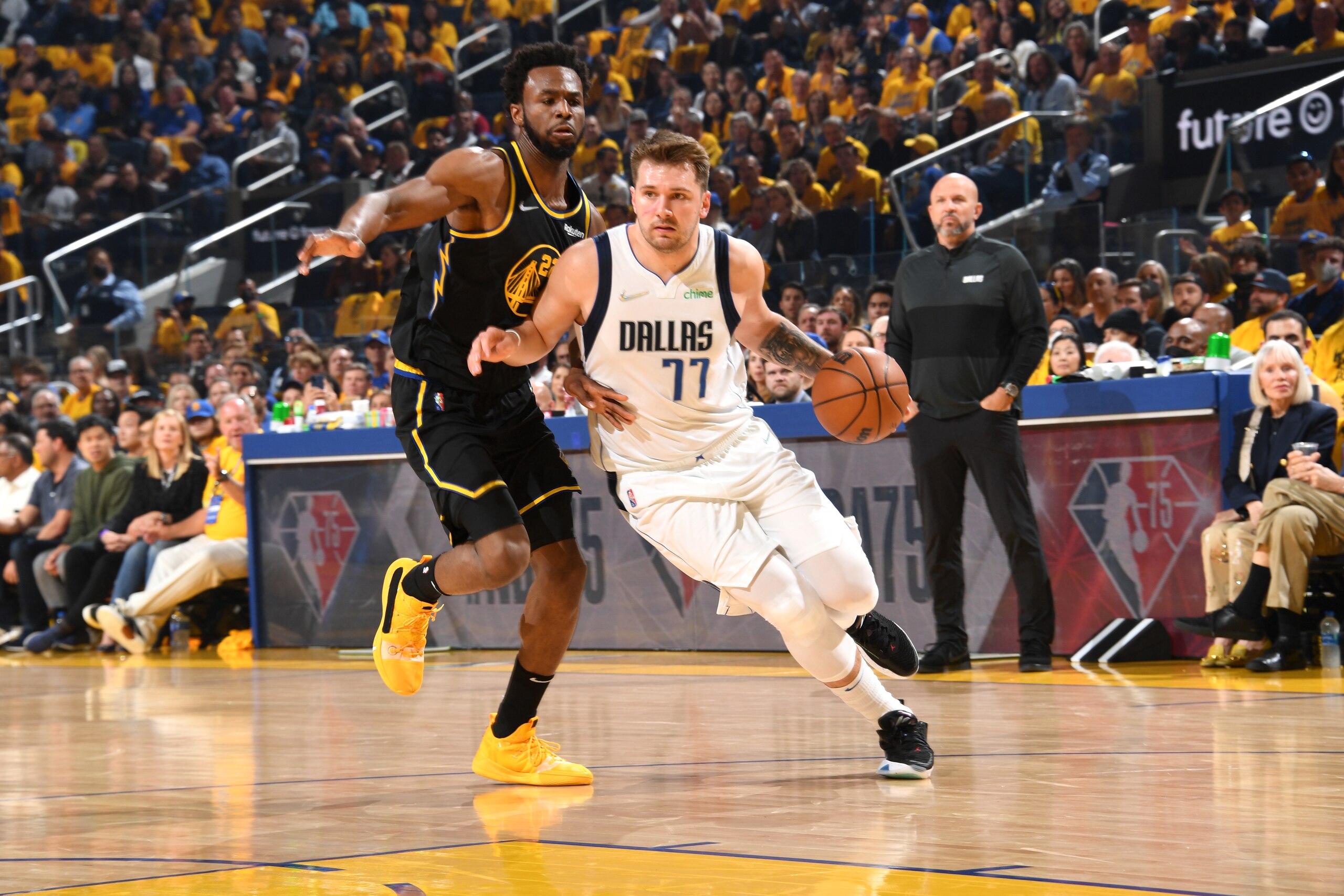 SAN FRANCISCO, CA - MAY 18: Andrew Wiggins #22 of the Golden State Warriors plays defense on Luka Doncic #77 of the Dallas Mavericks during Game 1 of the 2022 NBA Playoffs Western Conference Finals on May 18, 2022 at Chase Center in San Francisco, California. NOTE TO USER: User expressly acknowledges and agrees that, by downloading and or using this photograph, user is consenting to the terms and conditions of Getty Images License Agreement. Mandatory Copyright Notice: Copyright 2022 NBAE (Photo by  Andrew D. Bernstein/NBAE via Getty Images)