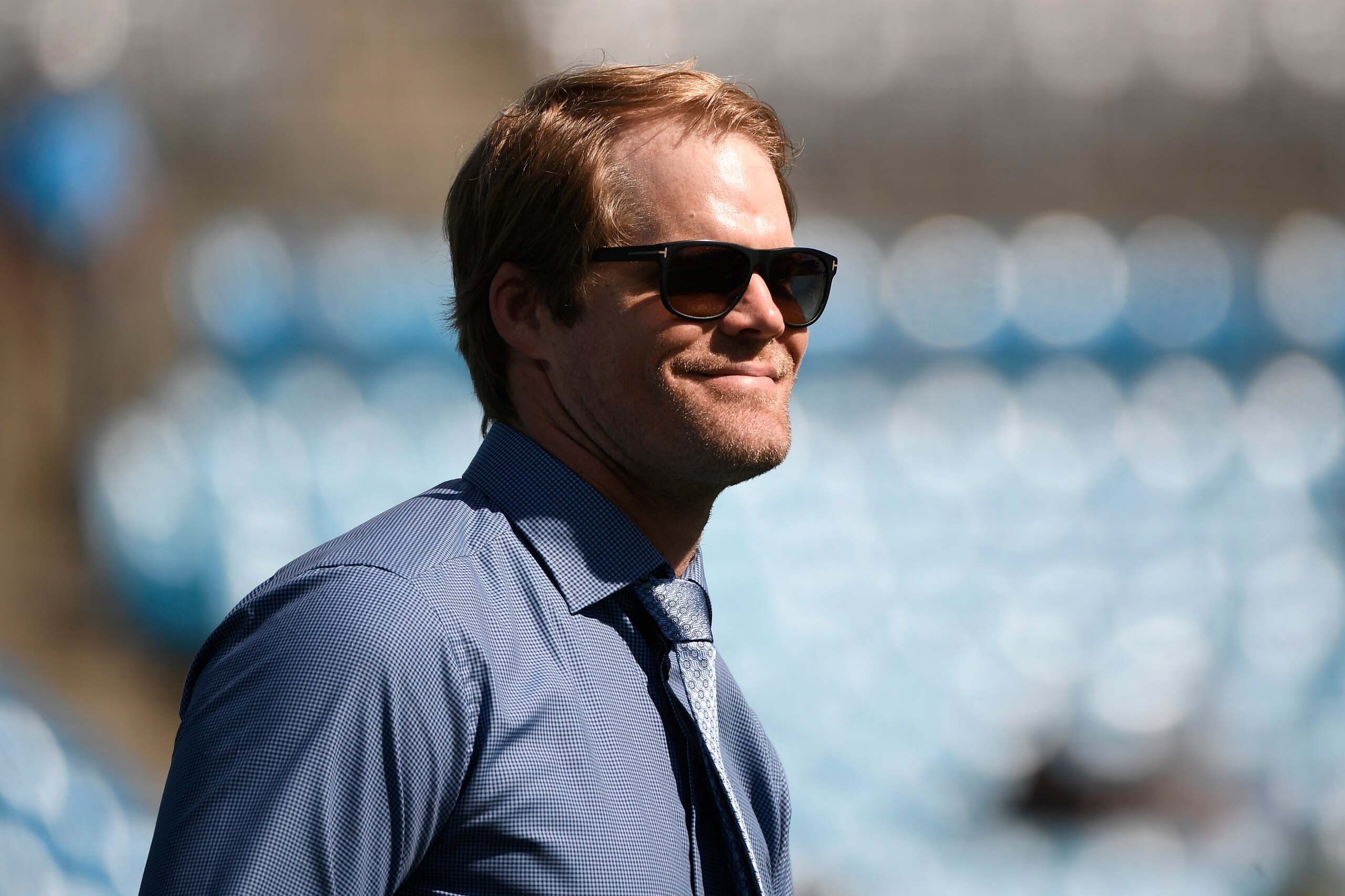 CHARLOTTE, NORTH CAROLINA - OCTOBER 10: Former player Greg Olsen of the Carolina Panthers reacts during the football game against the Philadelphia Eagles at Bank of America Stadium on October 10, 2021 in Charlotte, North Carolina. (Photo by Mike Comer/Getty Images)