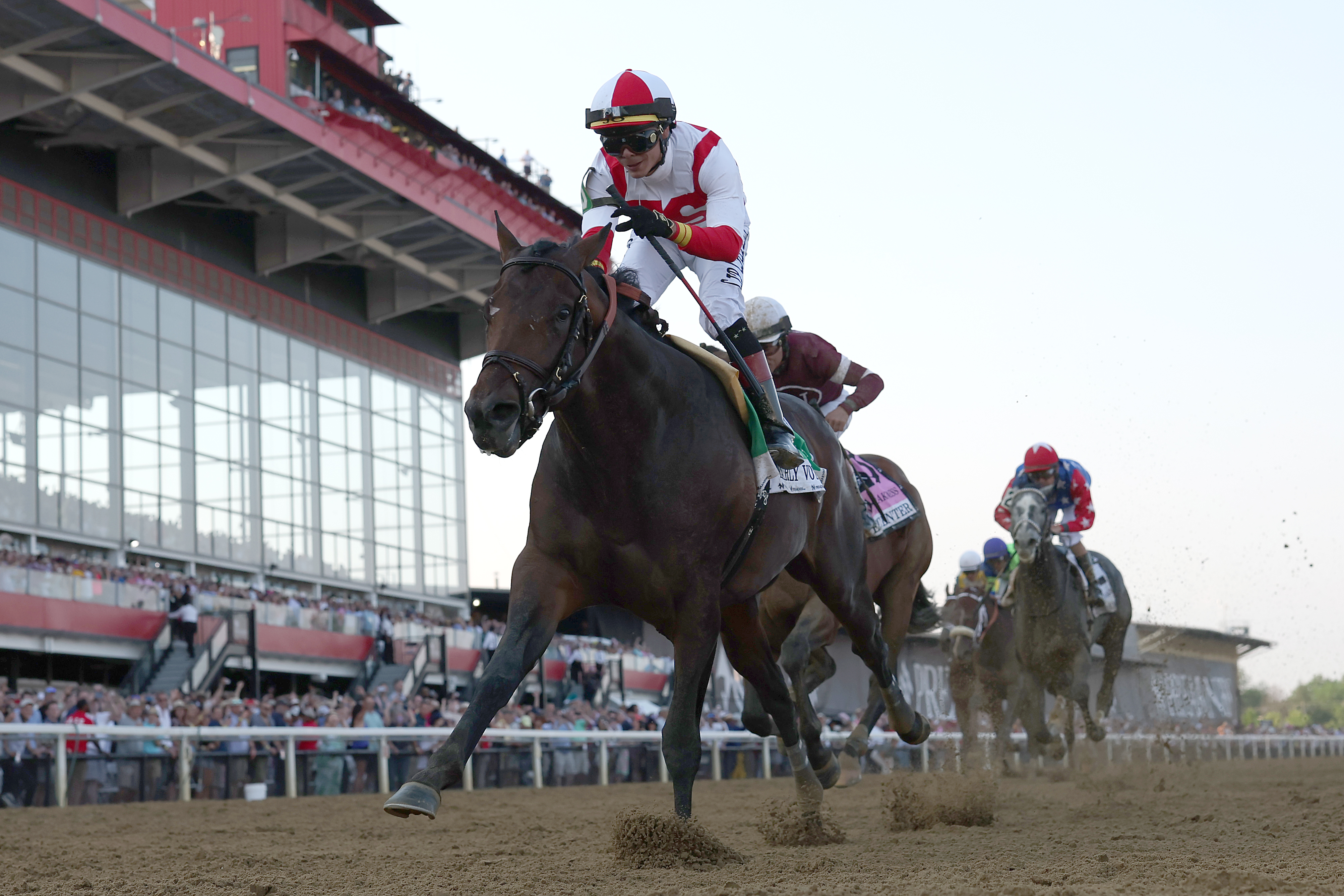 BALTIMORE, MARYLAND - MAY 21: Jockey Jose Ortiz #5 and Early Voting lead Epicenter and jockey Joel Rosario #8 to win the 147th Running of the Preakness Stakes at Pimlico Race Course on May 21, 2022 in Baltimore, Maryland. (Photo by Rob Carr/Getty Images)