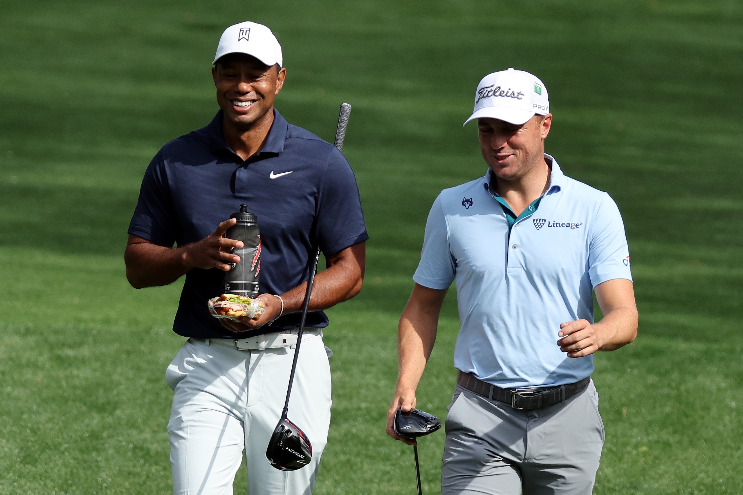 AUGUSTA, GEORGIA - APRIL 04: Tiger Woods of the United States and Justin Thomas of the United States walk on the seventh hole during a practice round prior to the Masters at Augusta National Golf Club on April 04, 2022 in Augusta, Georgia. (Photo by Gregory Shamus/Getty Images)