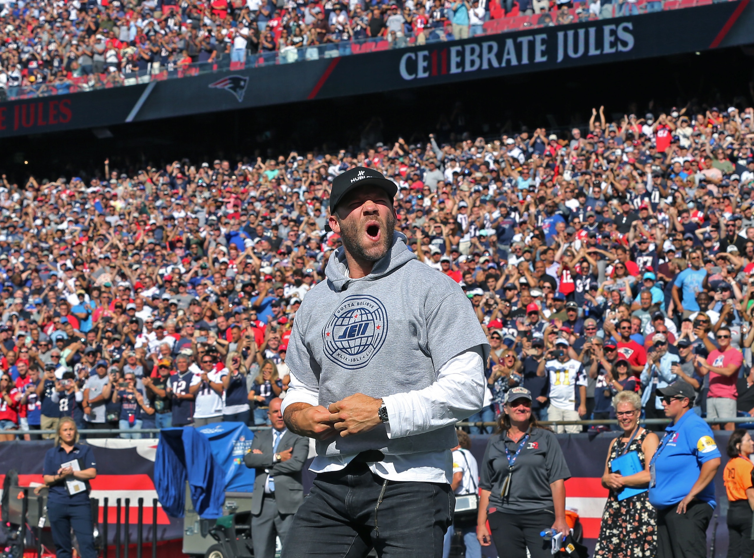Foxborough, MA - September 26: Retired Patriots wide receiver Julian Edelman was honored at halftime. He is pictured as he howled after running the length of the field before he spoke. The New England Patriots host the New Orlean Saints in an NFL game at Gillette Stadium in Foxborough, MA on Sept. 26, 2021. (Photo by Jim Davis/The Boston Globe via Getty Images)